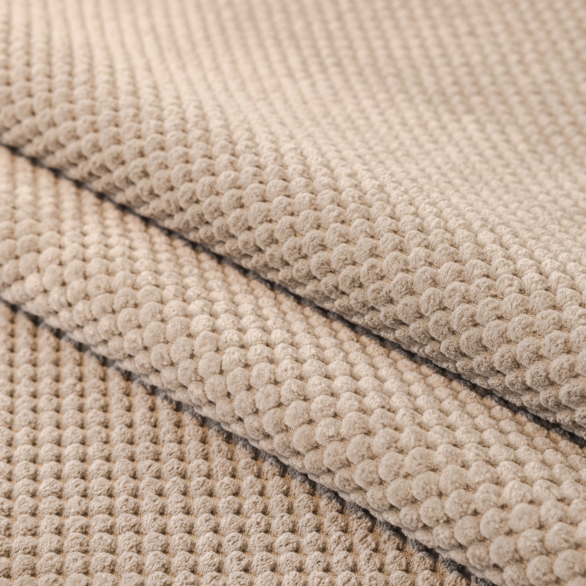 Textured beige fabric of Dog Washable Sofa Protector Cover, Non-Slip Couch Slipcover with Soft Furry Trim.