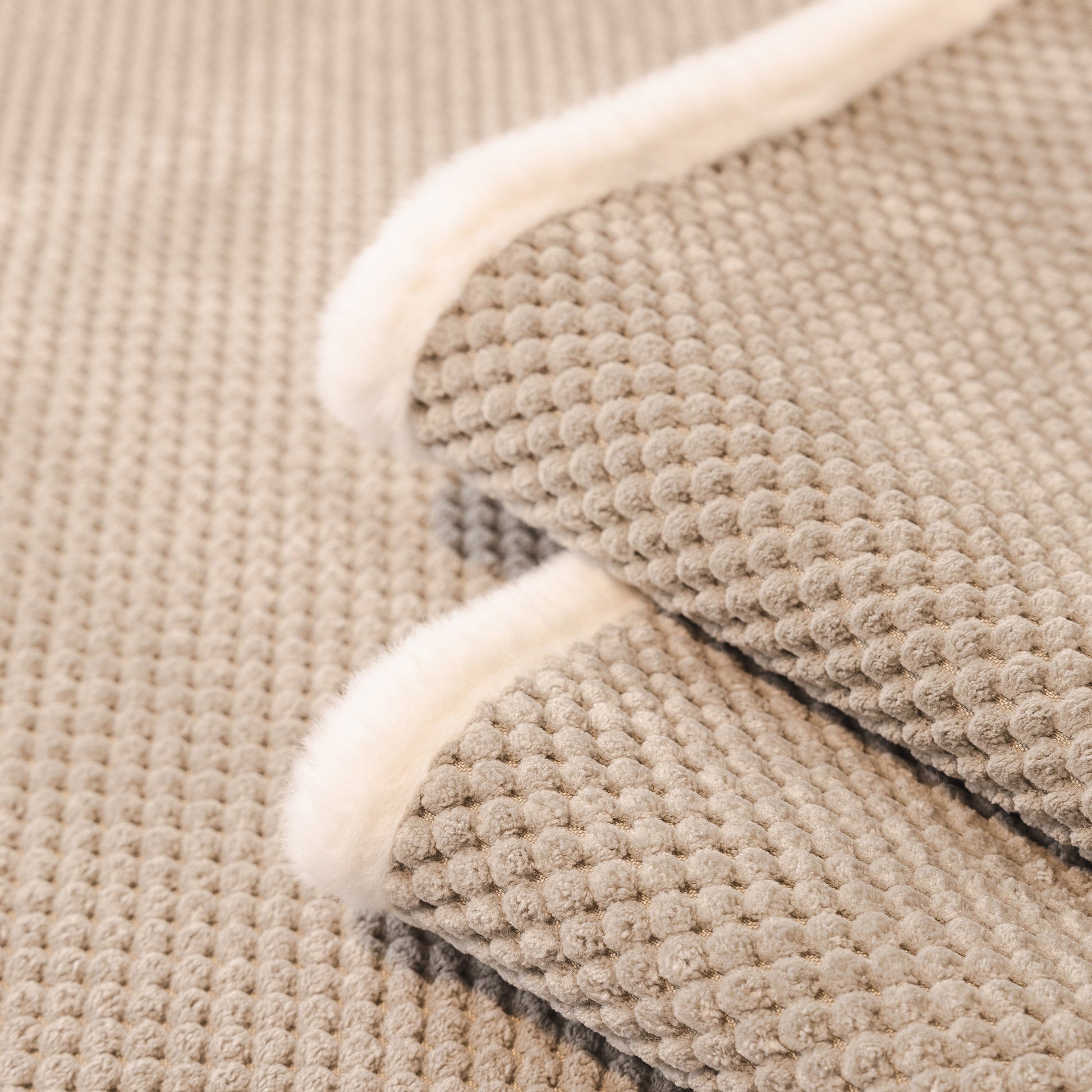 Dog Washable Sofa Protector Cover, Non-Slip Couch Slipcover with Soft Furry Trim in beige with honeycomb texture and fur trim.