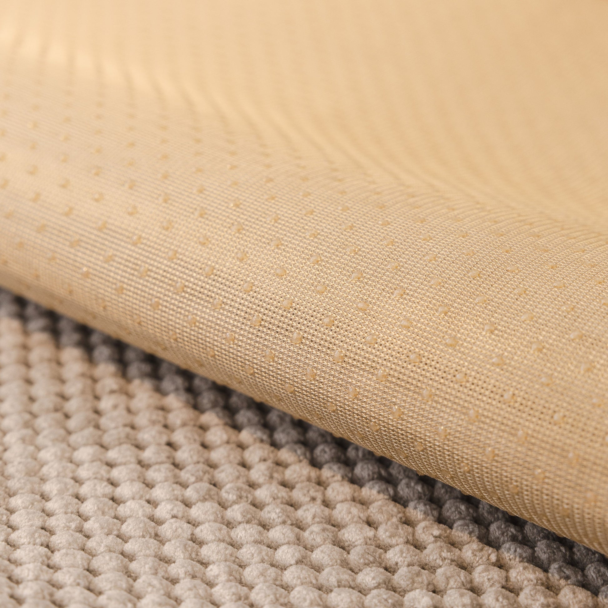Close-up of the non-slip silicone back of a Dog Washable Sofa Protector Cover with honeycomb texture and soft furry trim.