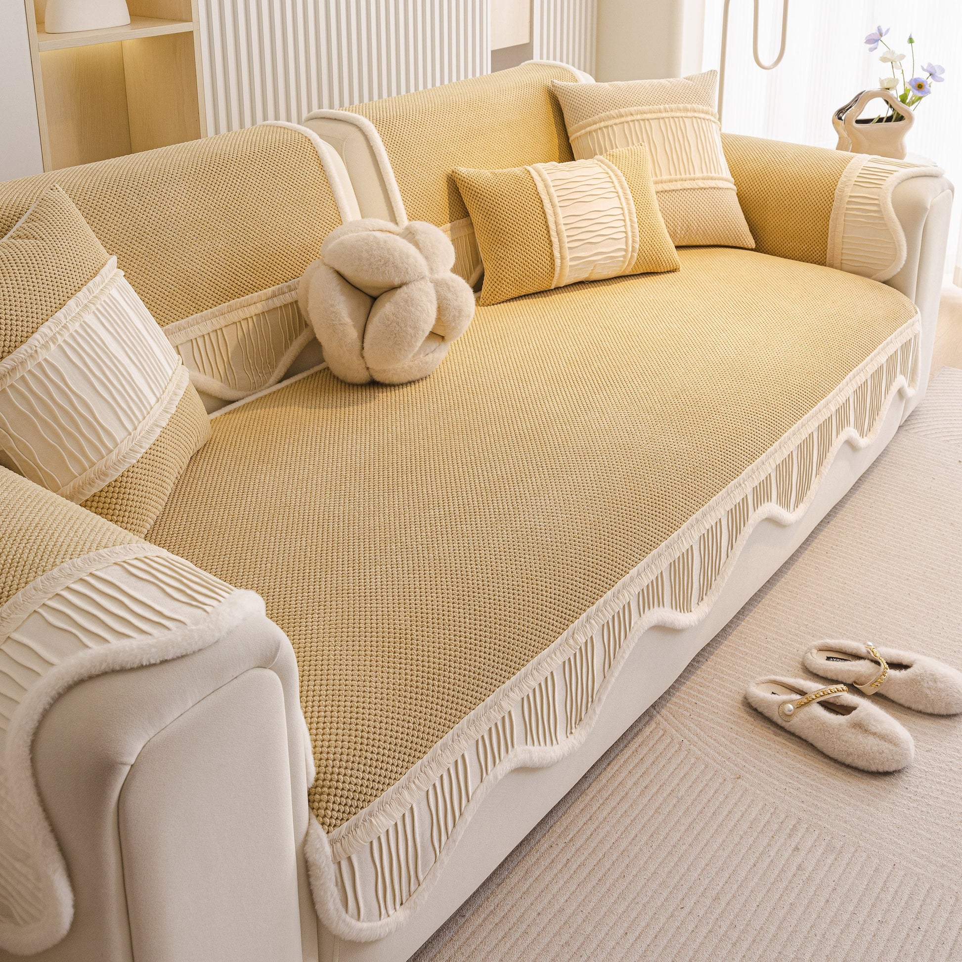 Dog Washable Sofa Protector Cover, Non-Slip Couch Slipcover with Soft Furry Trim in beige with pillows and slippers on floor
