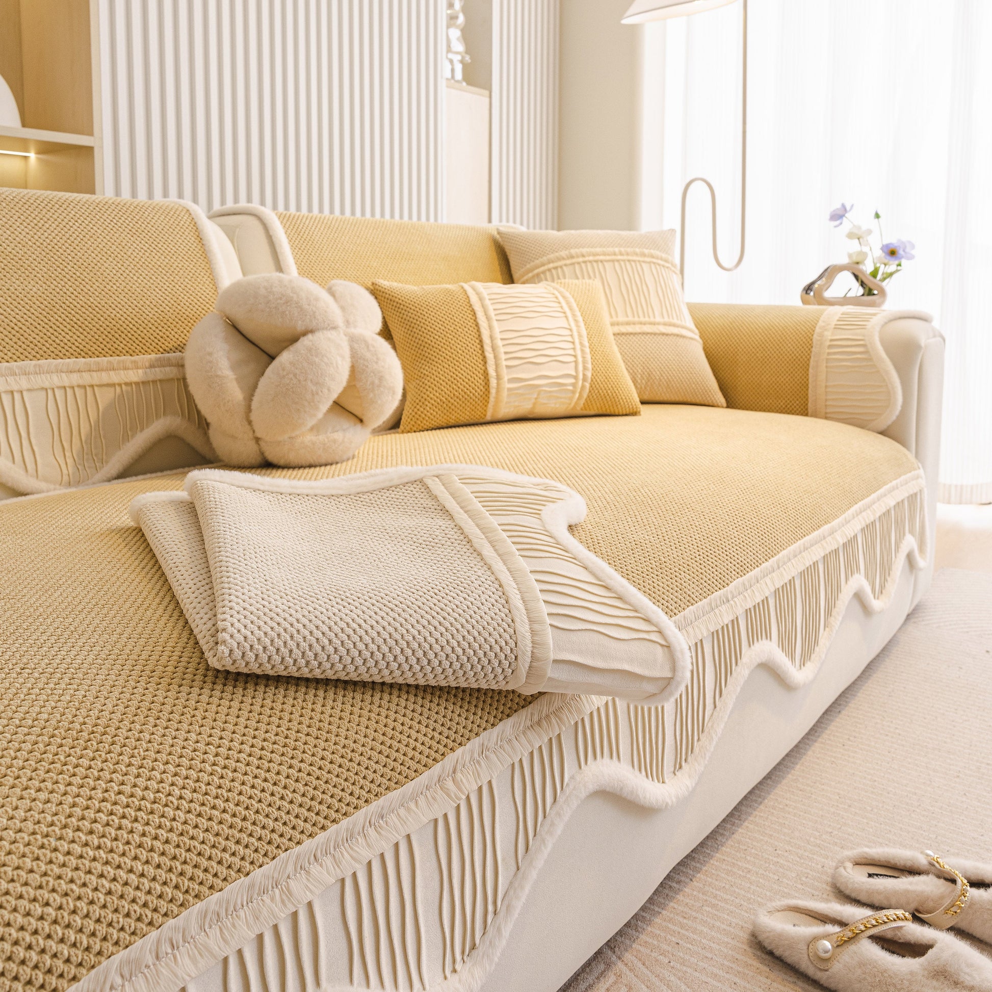 Dog Washable Sofa Protector Cover, Non-Slip Couch Slipcover with Soft Furry Trim in beige with decorative pillows.