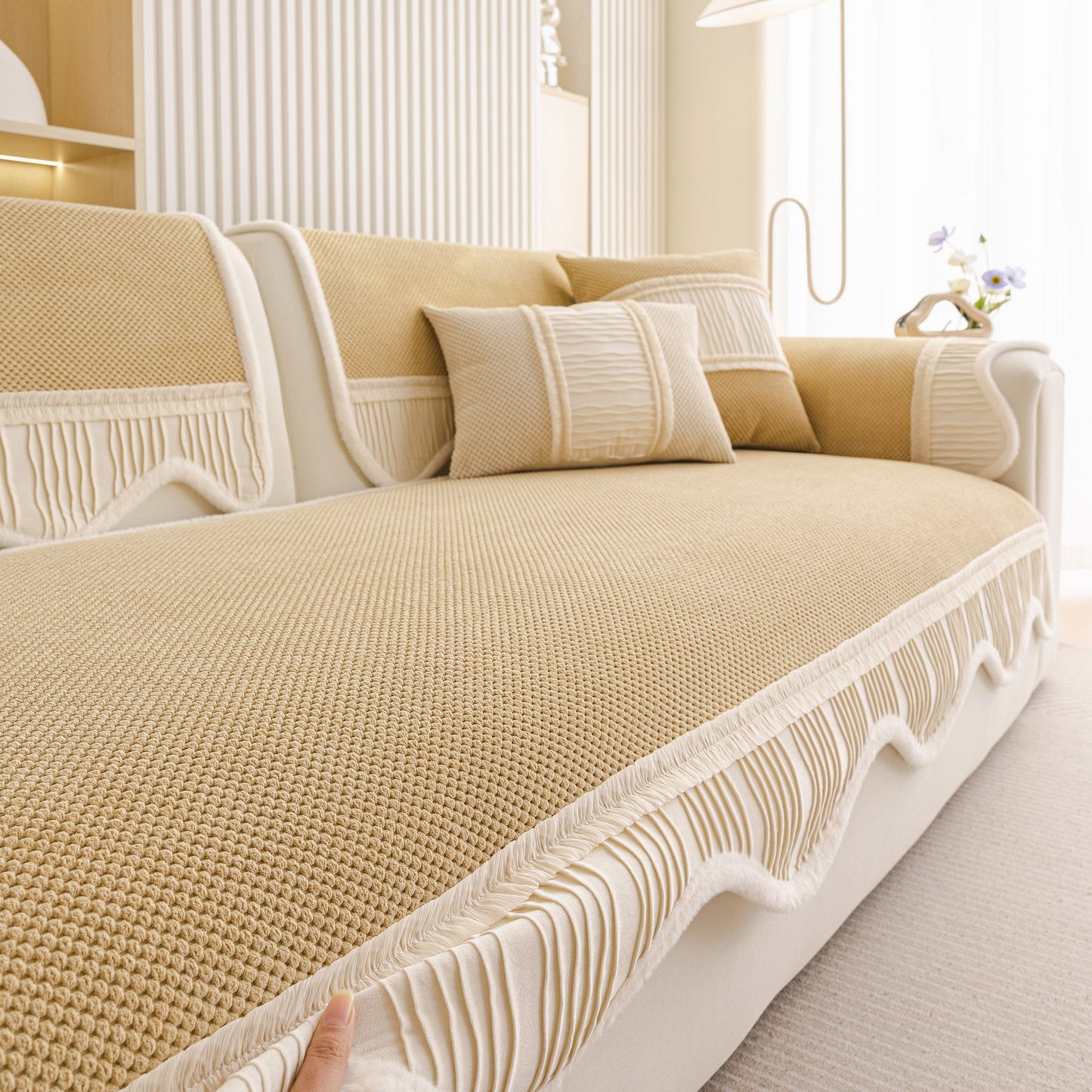 Dog Washable Sofa Protector Cover, Non-Slip Couch Slipcover with Soft Furry Trim in beige with honeycomb texture and pleated edges.