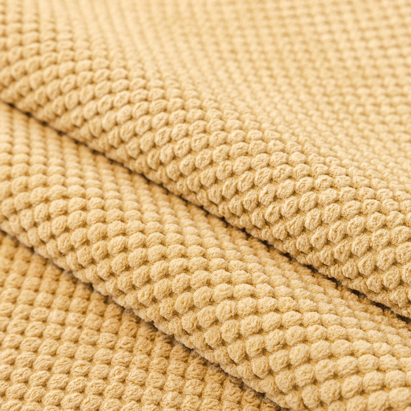 Close-up of beige honeycomb texture fabric for Dog Washable Sofa Protector Cover, Non-Slip Couch Slipcover with Soft Furry Trim.