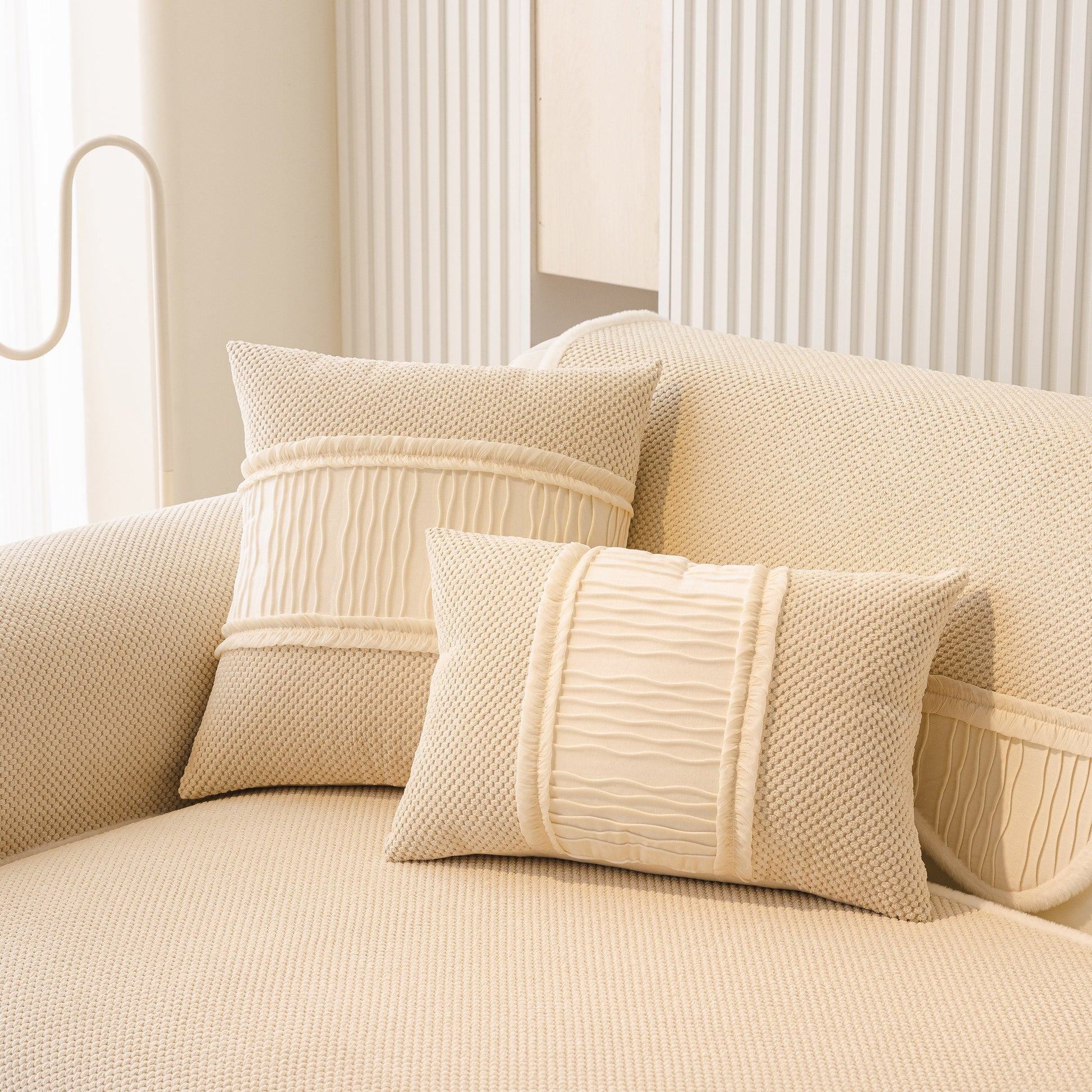 Dog Washable Sofa Protector Cover, Non-Slip Couch Slipcover with Soft Furry Trim in beige displayed on a sofa with matching pillows.