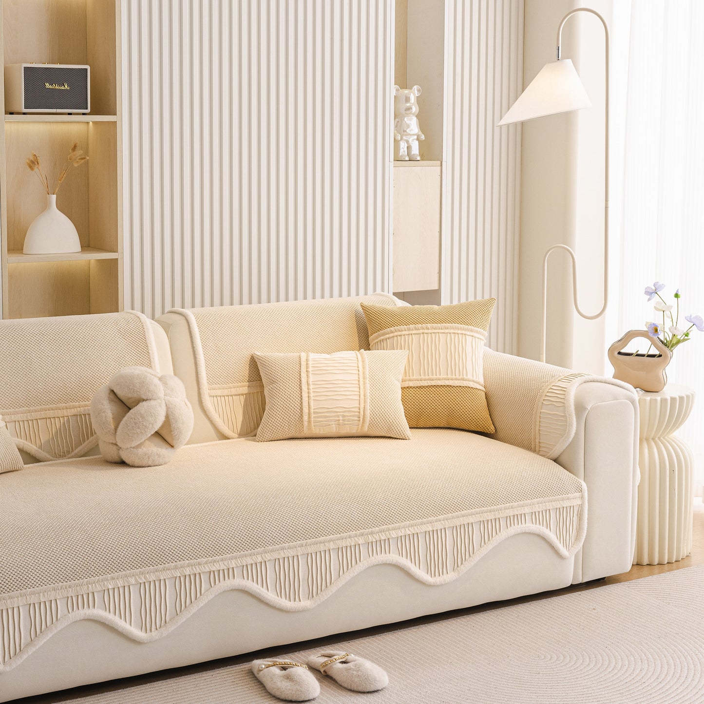 Dog Washable Sofa Protector Cover, Non-Slip Couch Slipcover with Soft Furry Trim in beige with pillows on a cream sofa.