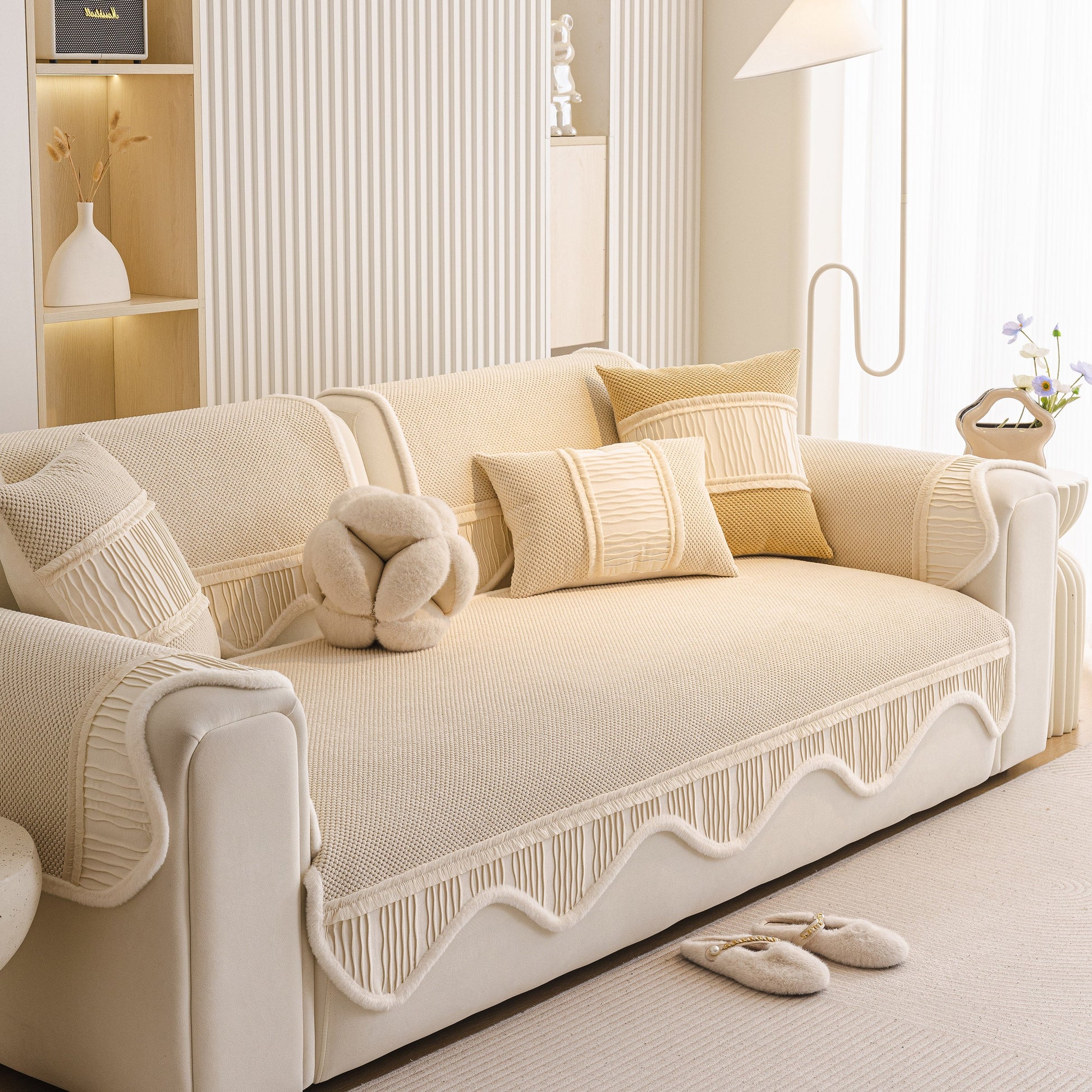 Dog Washable Sofa Protector Cover, Non-Slip Couch Slipcover with Soft Furry Trim in beige with decorative pillows on a cream sofa.