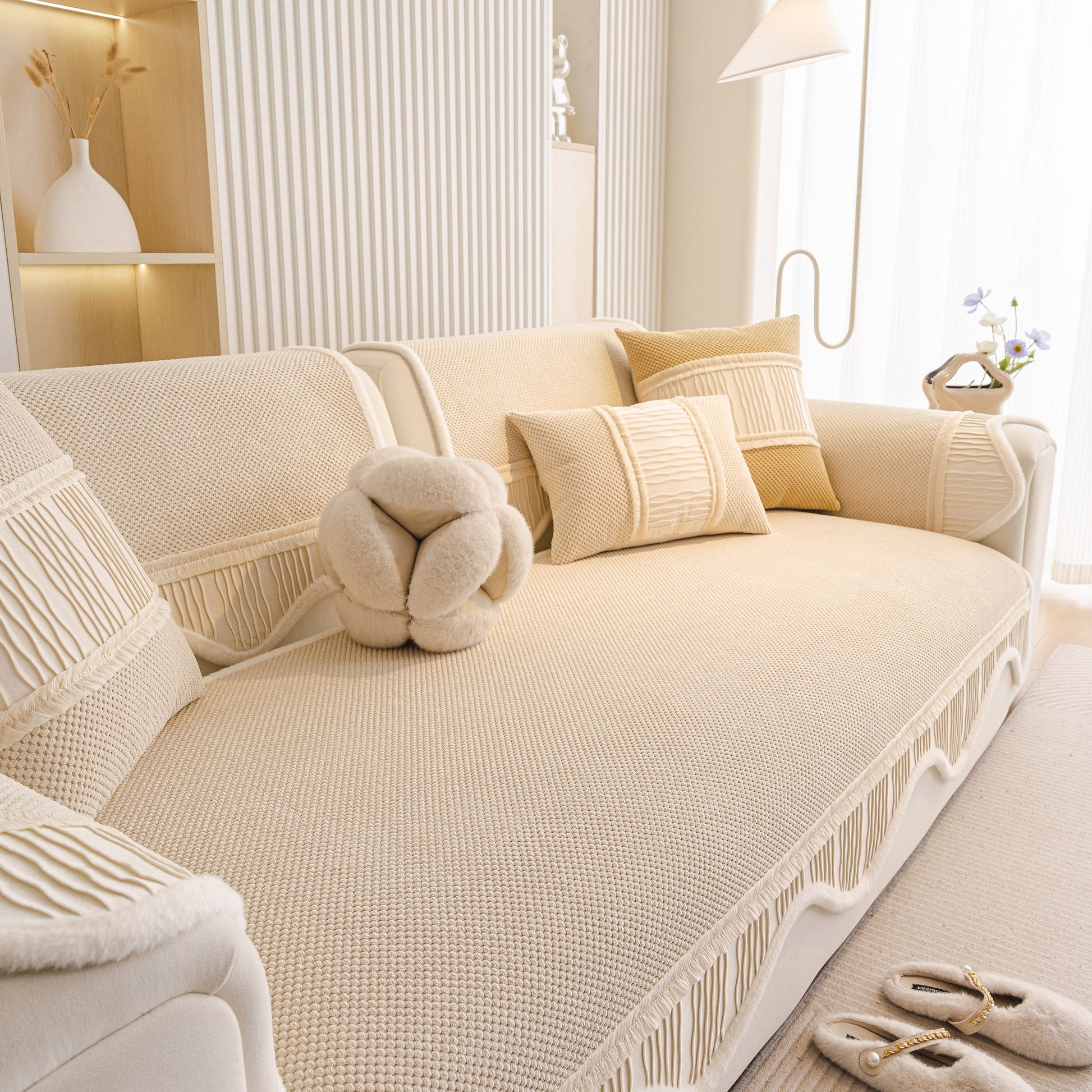 Dog Washable Sofa Protector Cover, Non-Slip Couch Slipcover with Soft Furry Trim in beige with decorative pillows in a cozy living room.