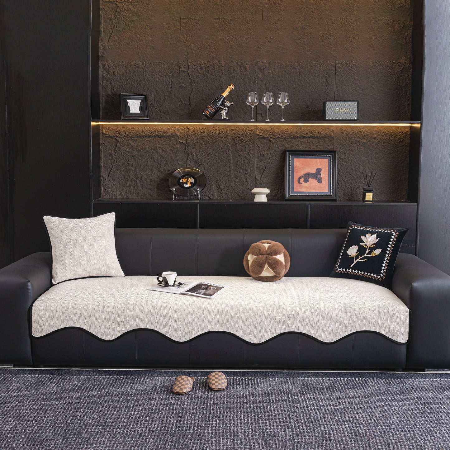 Chenille Couch Cover with Scalloped Edge on a modern black sofa, showcasing a plush, textured fabric in a stylish living room setting.