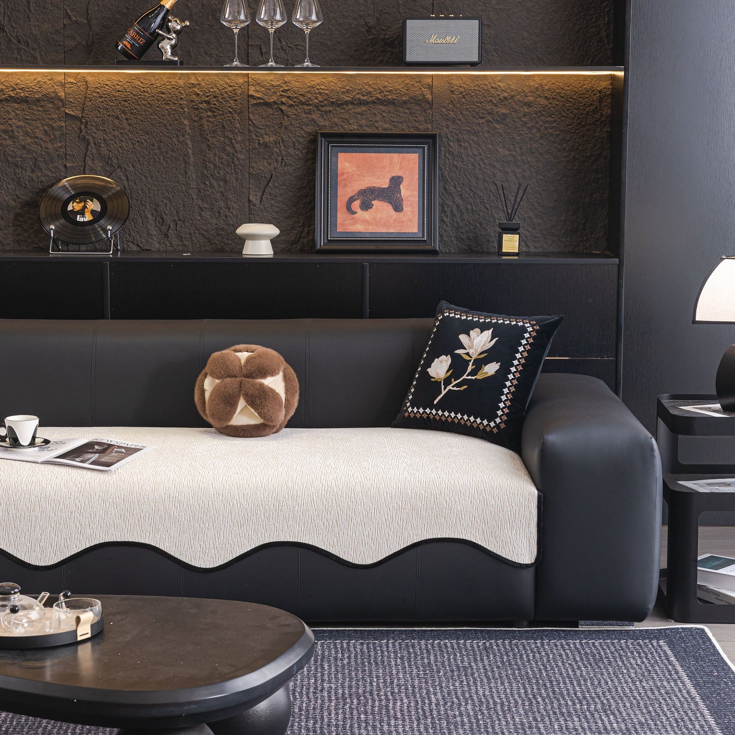 Chenille Couch Cover with Scalloped Edge on black leather sofa, featuring non-slip modular slipcover sectional design in elegant living room