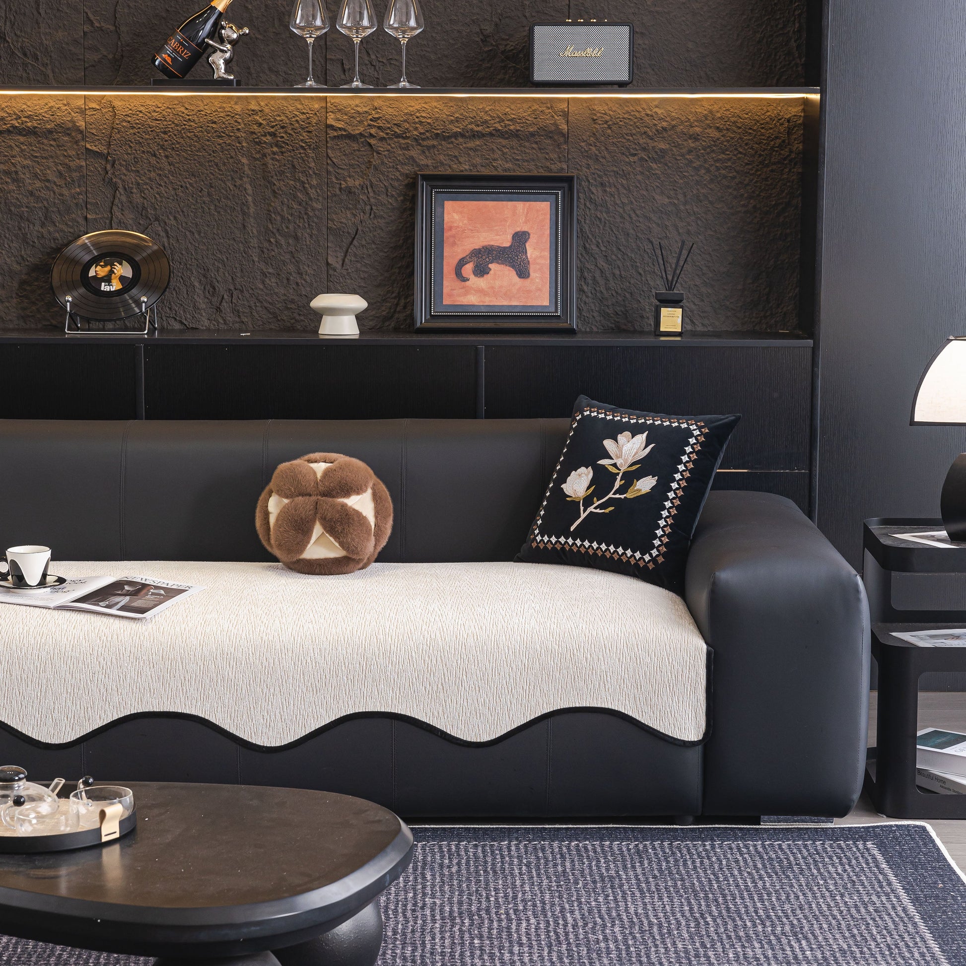 Chenille Couch Cover with Scalloped Edge on black leather sofa, featuring non-slip modular slipcover sectional design in elegant living room