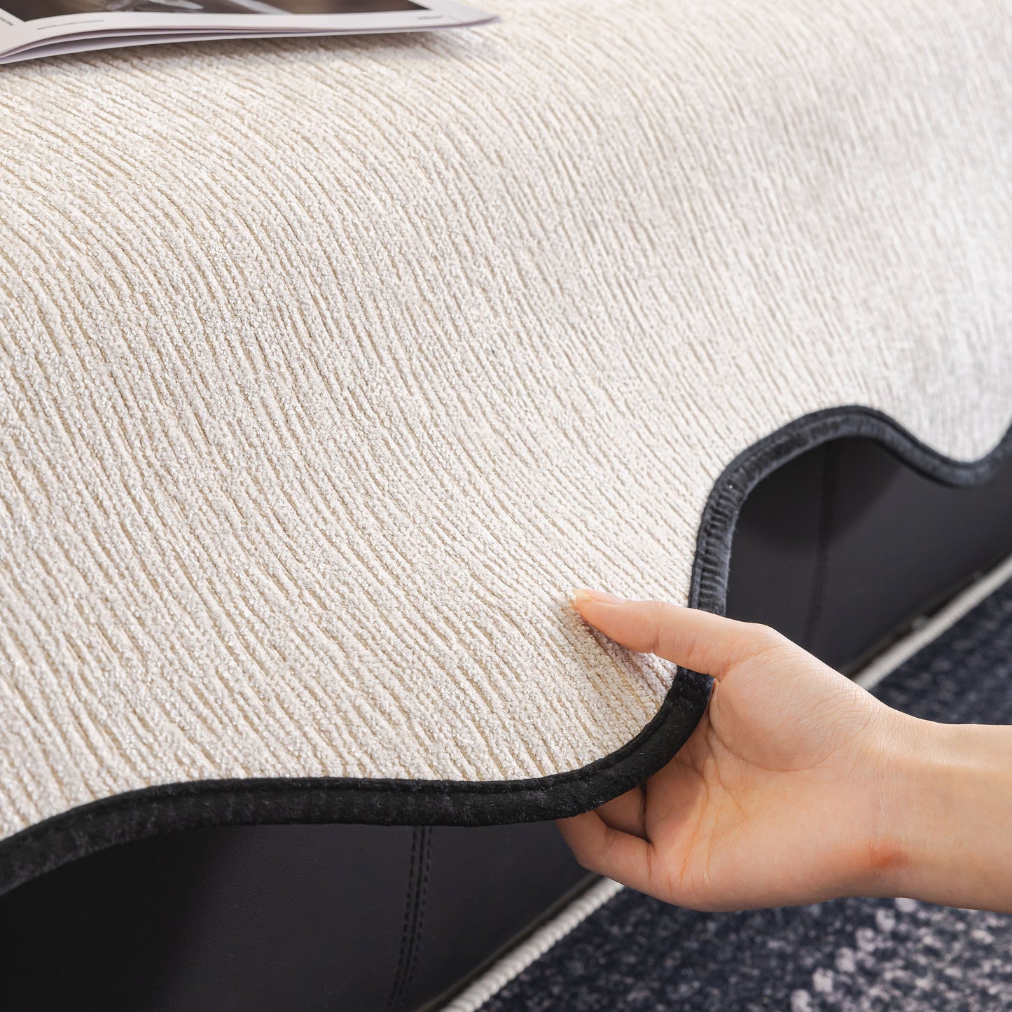 Chenille Couch Cover with Scalloped Edge being adjusted on a sofa, showing non-slip modular slipcover detail