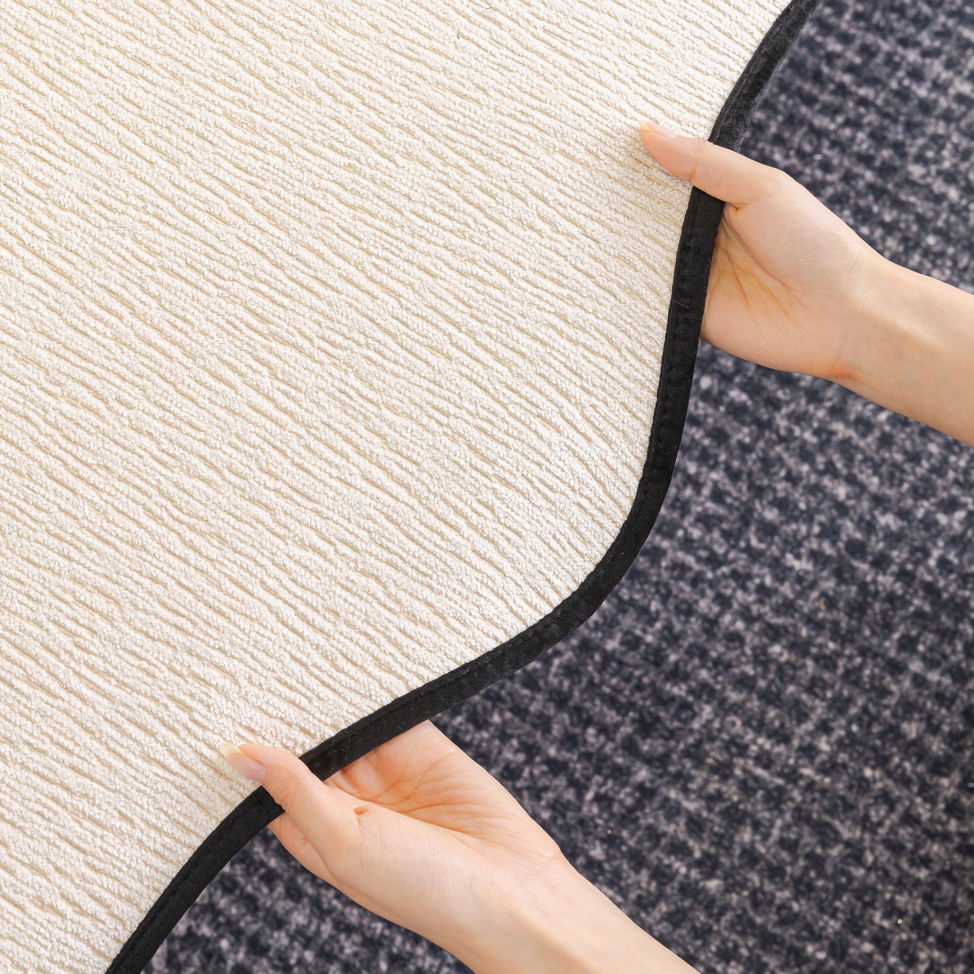 Hands holding Chenille Couch Cover with Scalloped Edge, Non-Slip Modular Slipcover Sectional showing texture and scalloped design.
