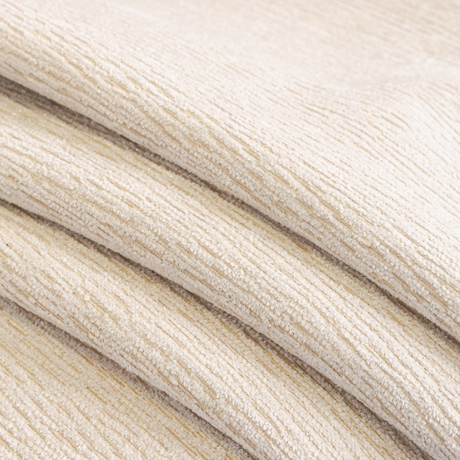 Close-up of Chenille Couch Cover with Scalloped Edge, Non-Slip Modular Slipcover Sectional in soft, textured chenille fabric.