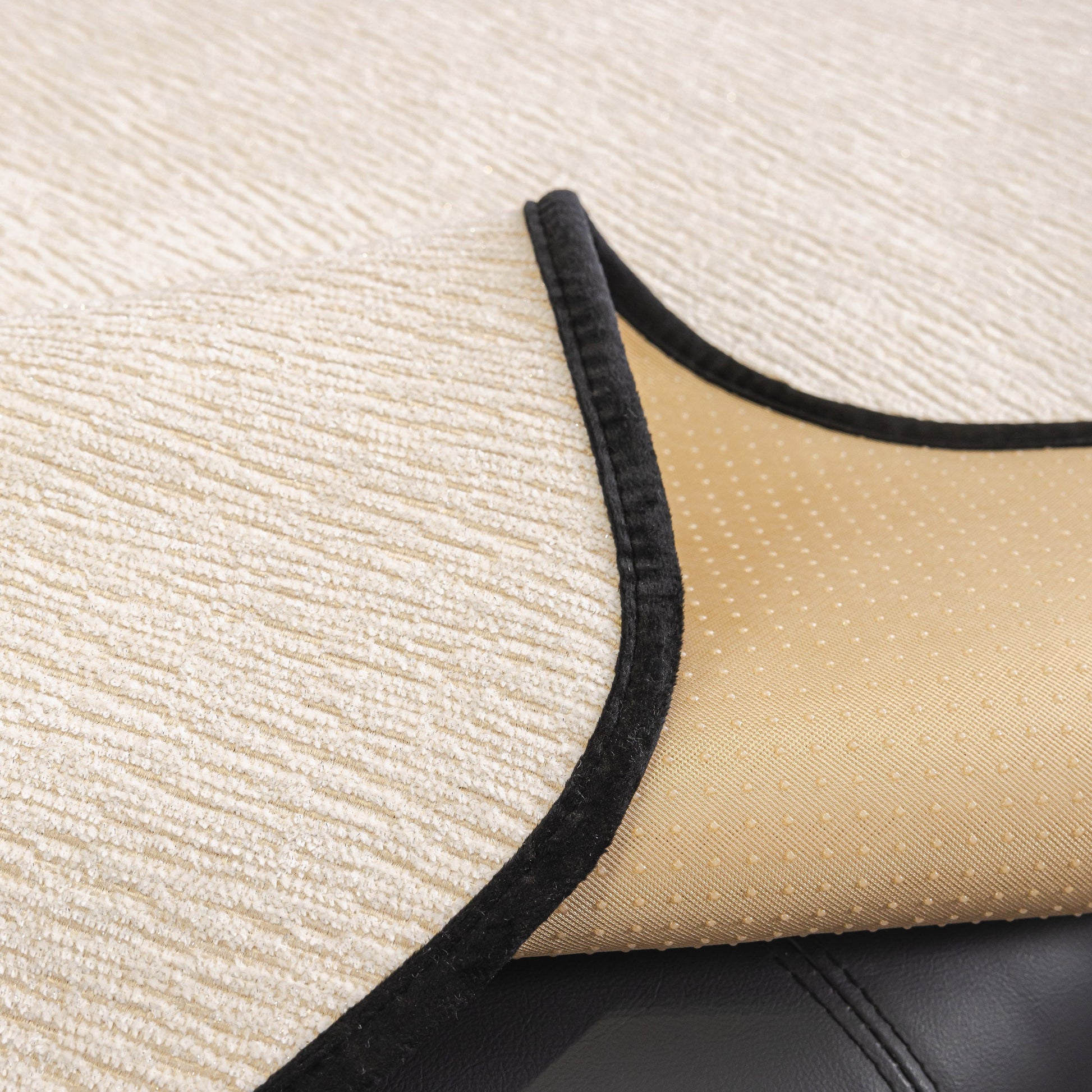 Close-up of Chenille Couch Cover with Scalloped Edge showcasing non-slip backing on a sofa