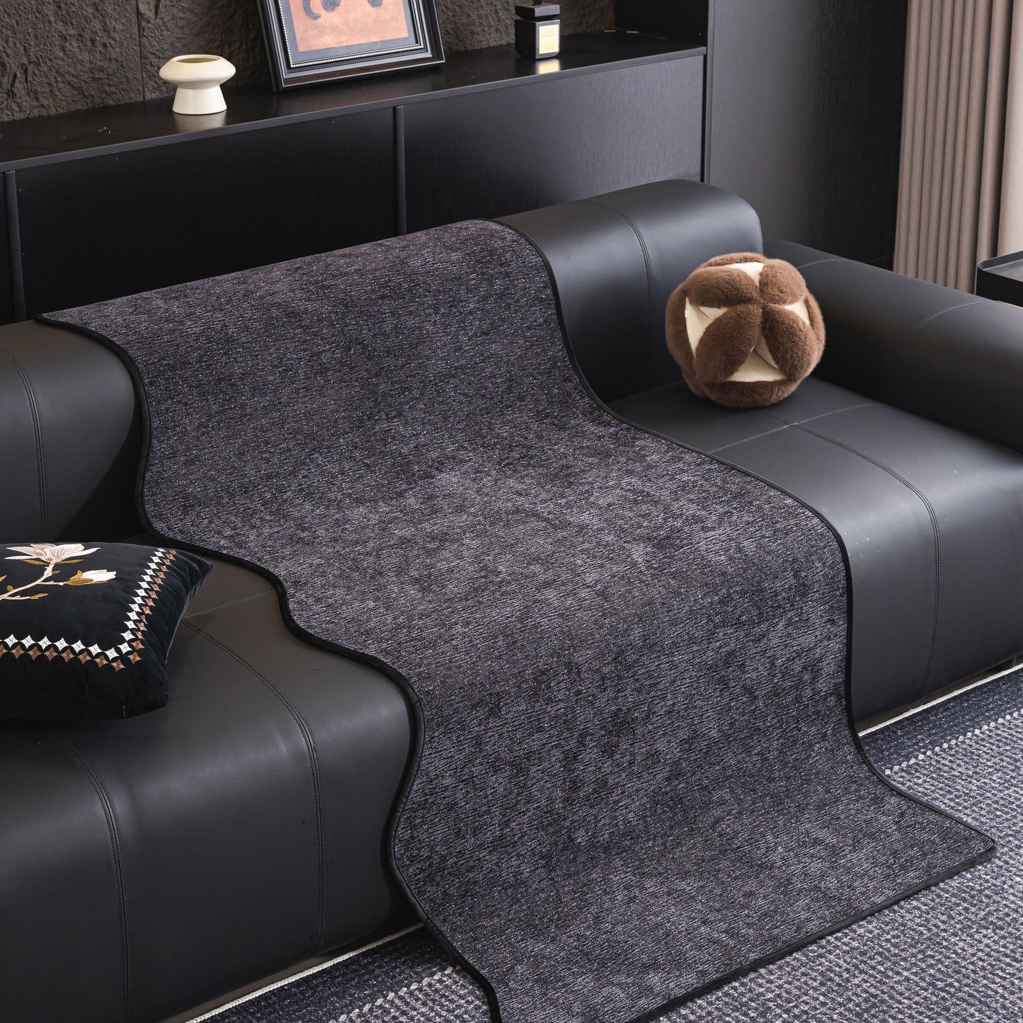 Chenille Couch Cover with Scalloped Edge, Non-Slip Modular Slipcover Sectional on black leather sofa in modern living room