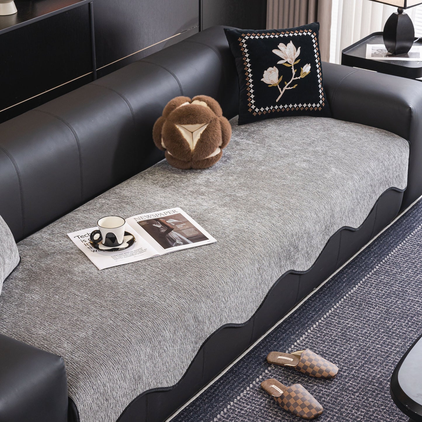 Elegant living room with Chenille Couch Cover with Scalloped Edge, Non-Slip Modular Slipcover Sectional on black sofa
