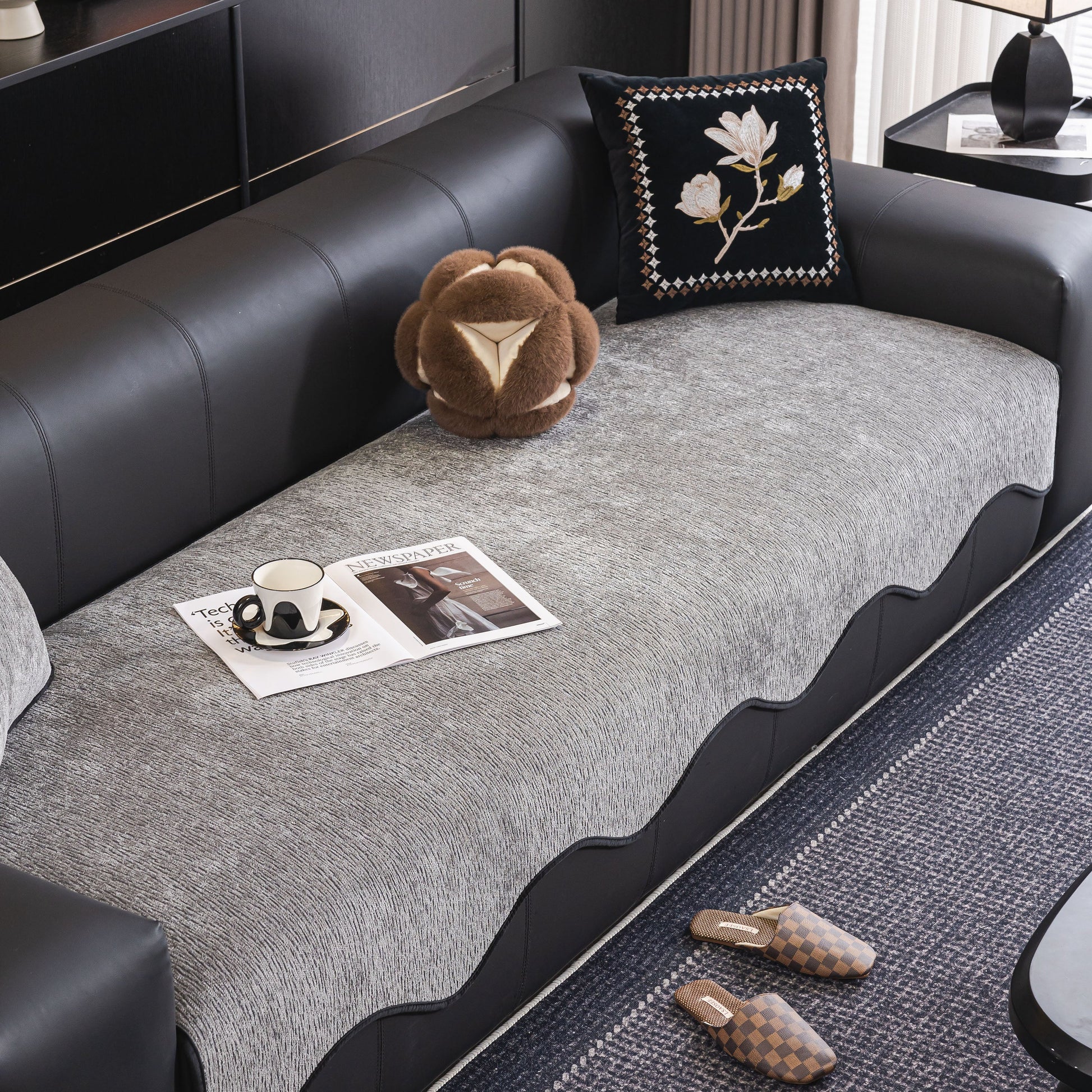 Elegant living room with Chenille Couch Cover with Scalloped Edge, Non-Slip Modular Slipcover Sectional on black sofa