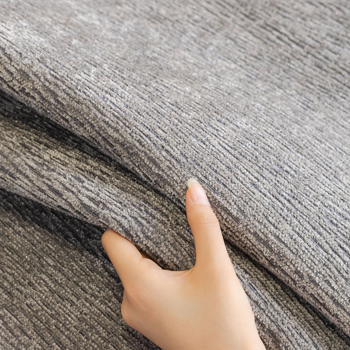 Hand touching Chenille Couch Cover with Scalloped Edge, Non-Slip Modular Slipcover Sectional