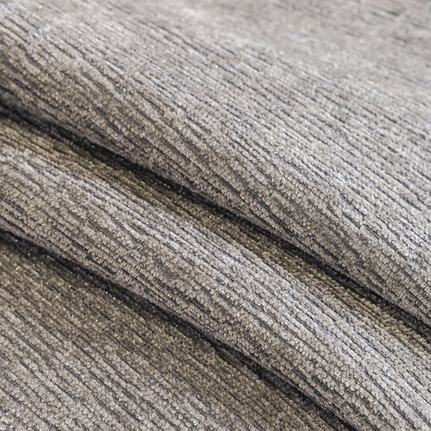 Close-up of Chenille Couch Cover with Scalloped Edge, Non-Slip Modular Slipcover Sectional in gray texture, showcasing plush fabric detail.