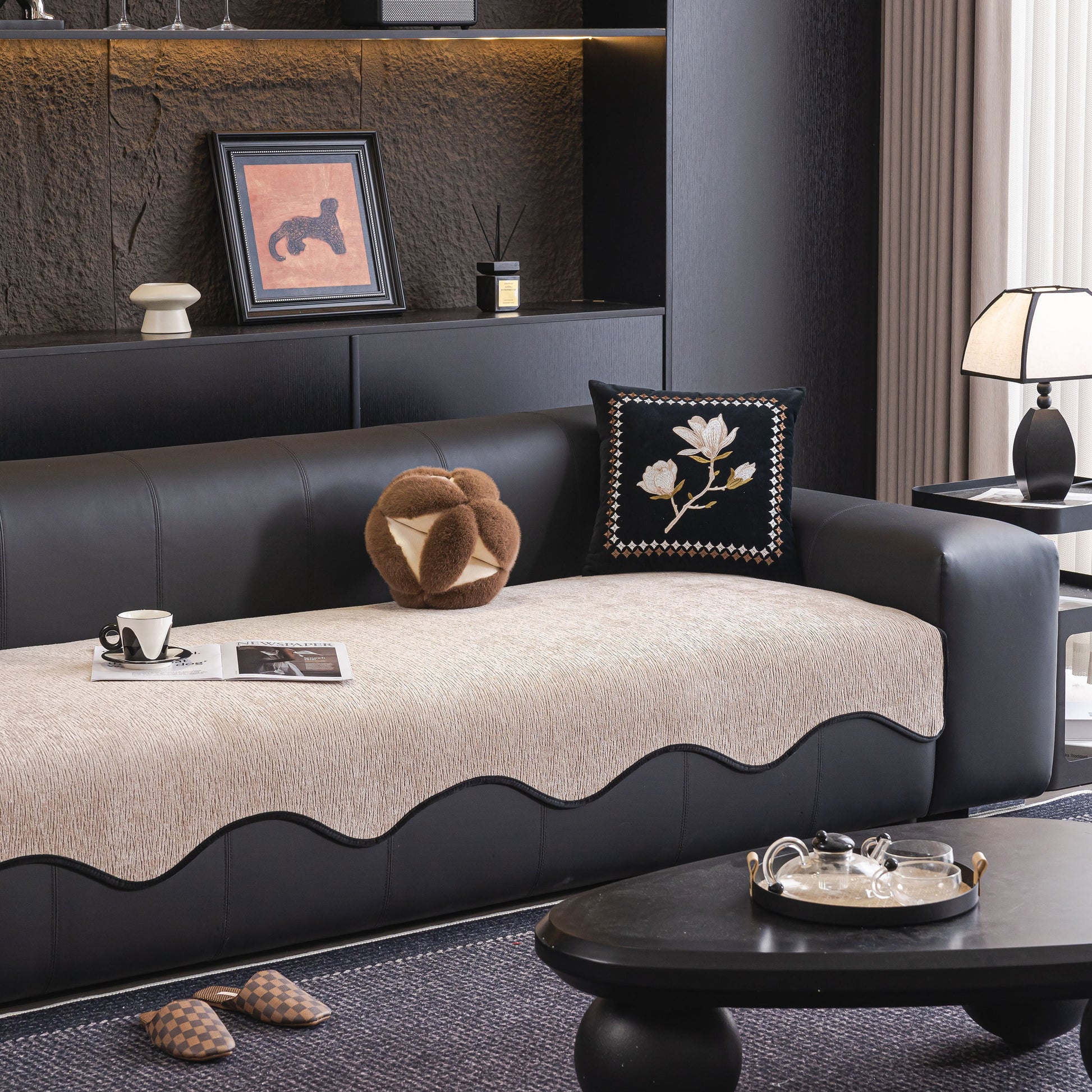Luxurious Chenille Couch Cover with Scalloped Edge, Non-Slip Modular Slipcover Sectional on sleek black sofa in modern living room