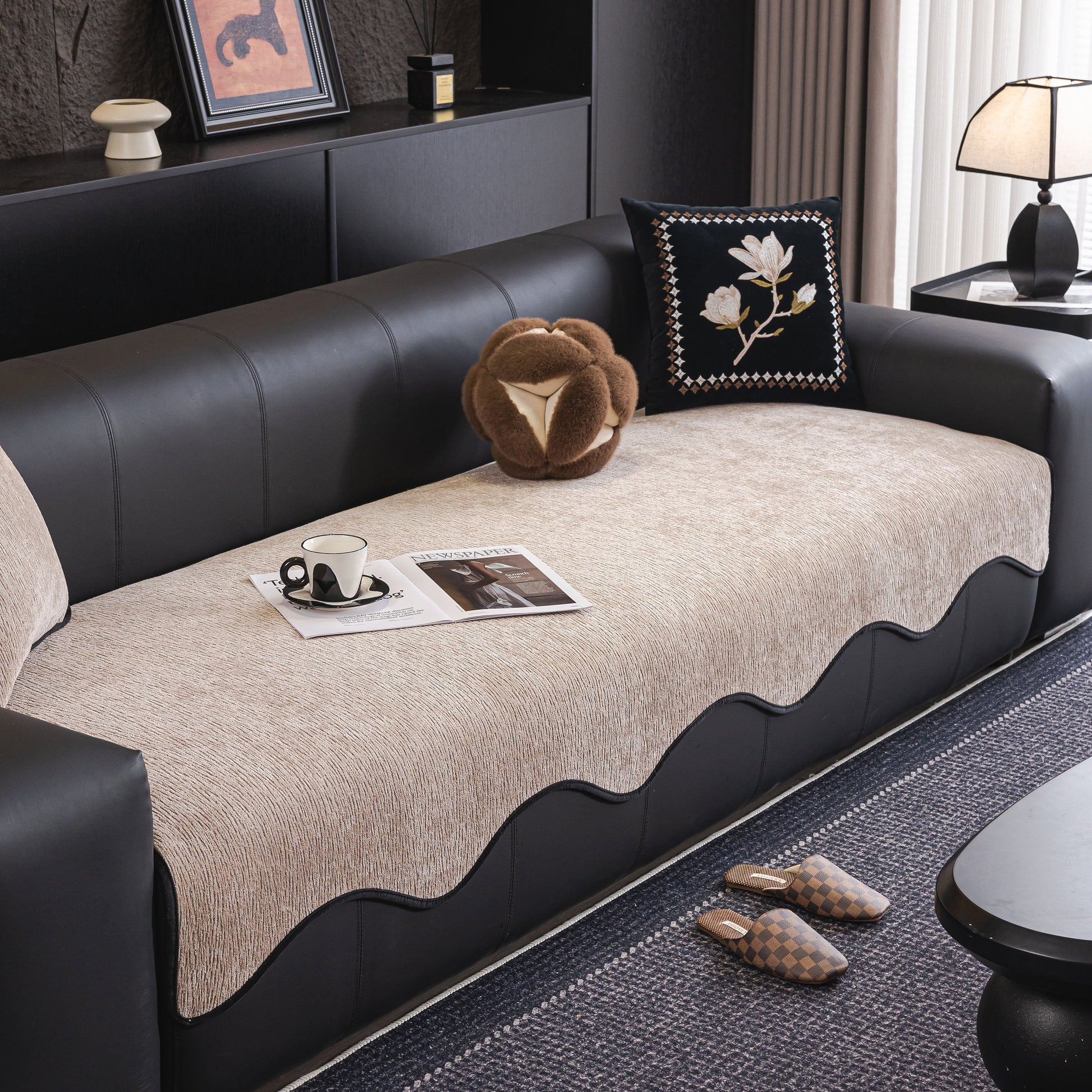 Chenille Couch Cover with Scalloped Edge, Non-Slip Modular Slipcover Sectional on a black sofa in a modern living room.