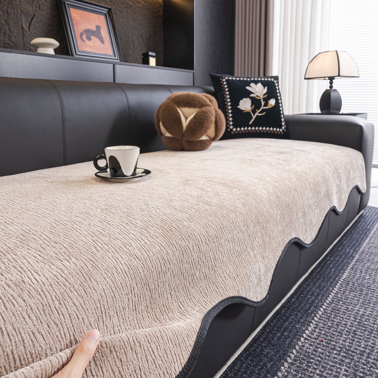 Chenille Couch Cover with Scalloped Edge, Non-Slip Modular Slipcover Sectional on black sofa with cup and decor