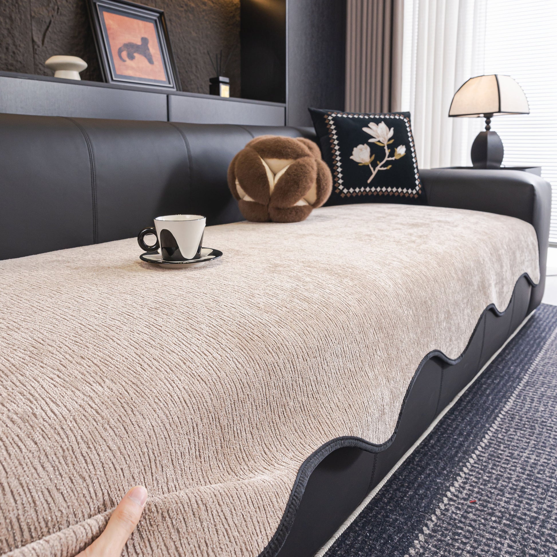 Chenille Couch Cover with Scalloped Edge, Non-Slip Modular Slipcover Sectional on black sofa with cup and decor