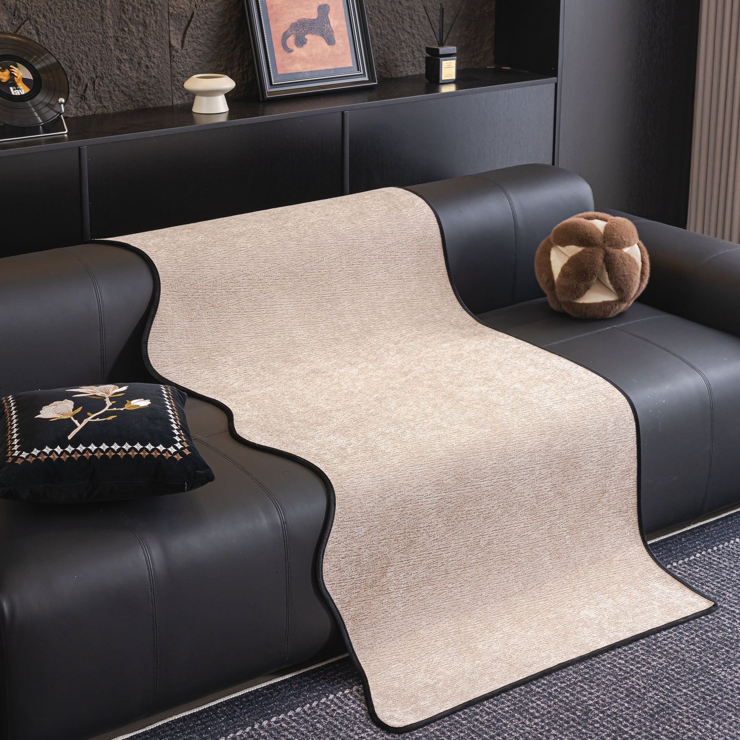 Chenille Couch Cover with Scalloped Edge, Non-Slip Modular Slipcover Sectional on a black sofa, showcasing elegant design and comfort.
