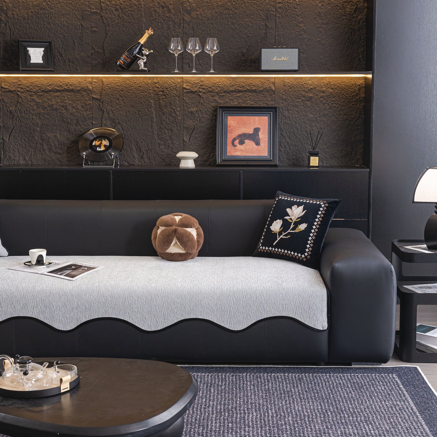 Chenille Couch Cover with Scalloped Edge on black sofa, featuring plush texture in modern living room setting.