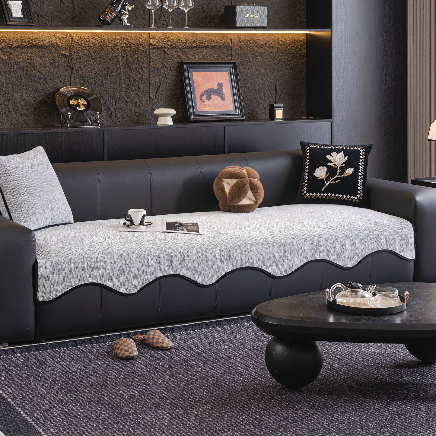 Chenille Couch Cover with Scalloped Edge, Non-Slip Modular Slipcover Sectional on a black sofa in a modern living room