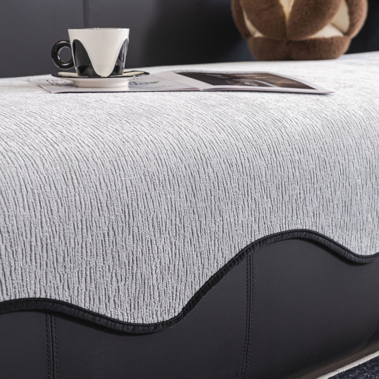 Chenille Couch Cover with Scalloped Edge, Non-Slip Modular Slipcover Sectional on a sofa with a coffee cup and magazine on top