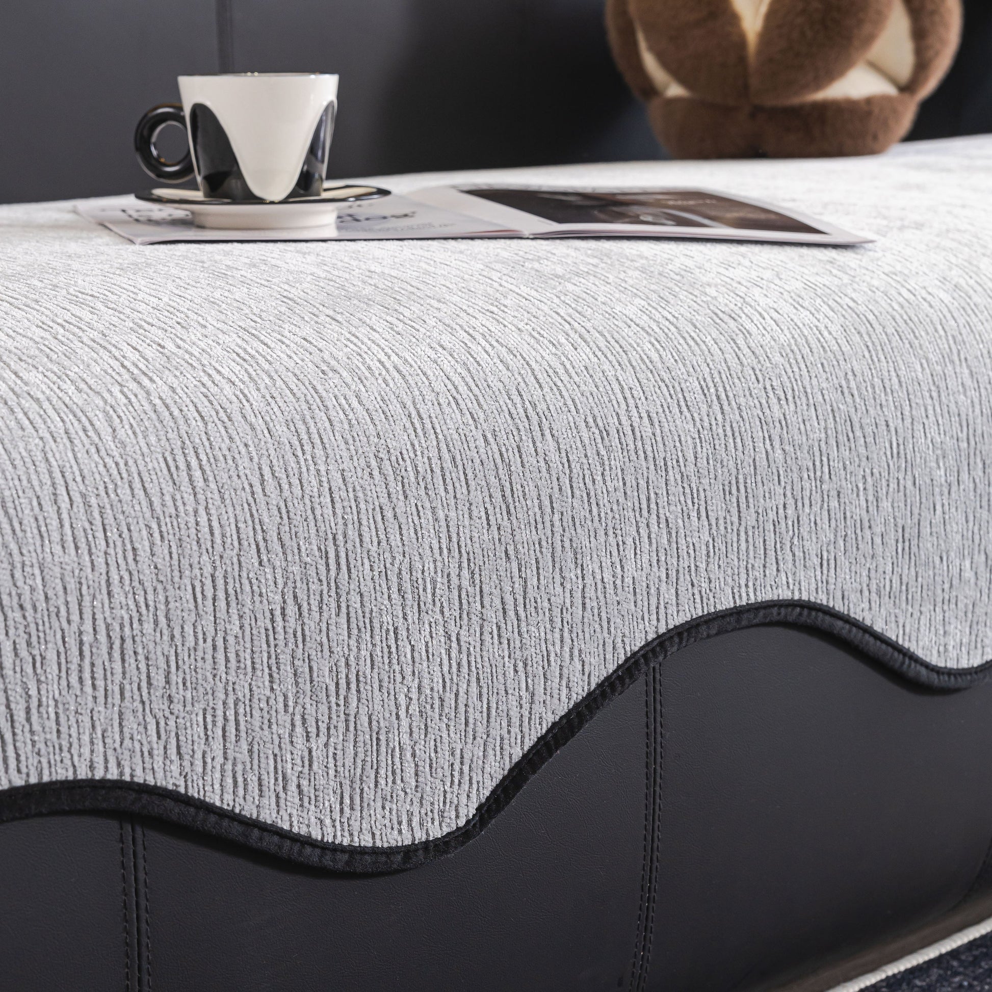 Chenille Couch Cover with Scalloped Edge, Non-Slip Modular Slipcover Sectional on a sofa with a coffee cup and magazine on top