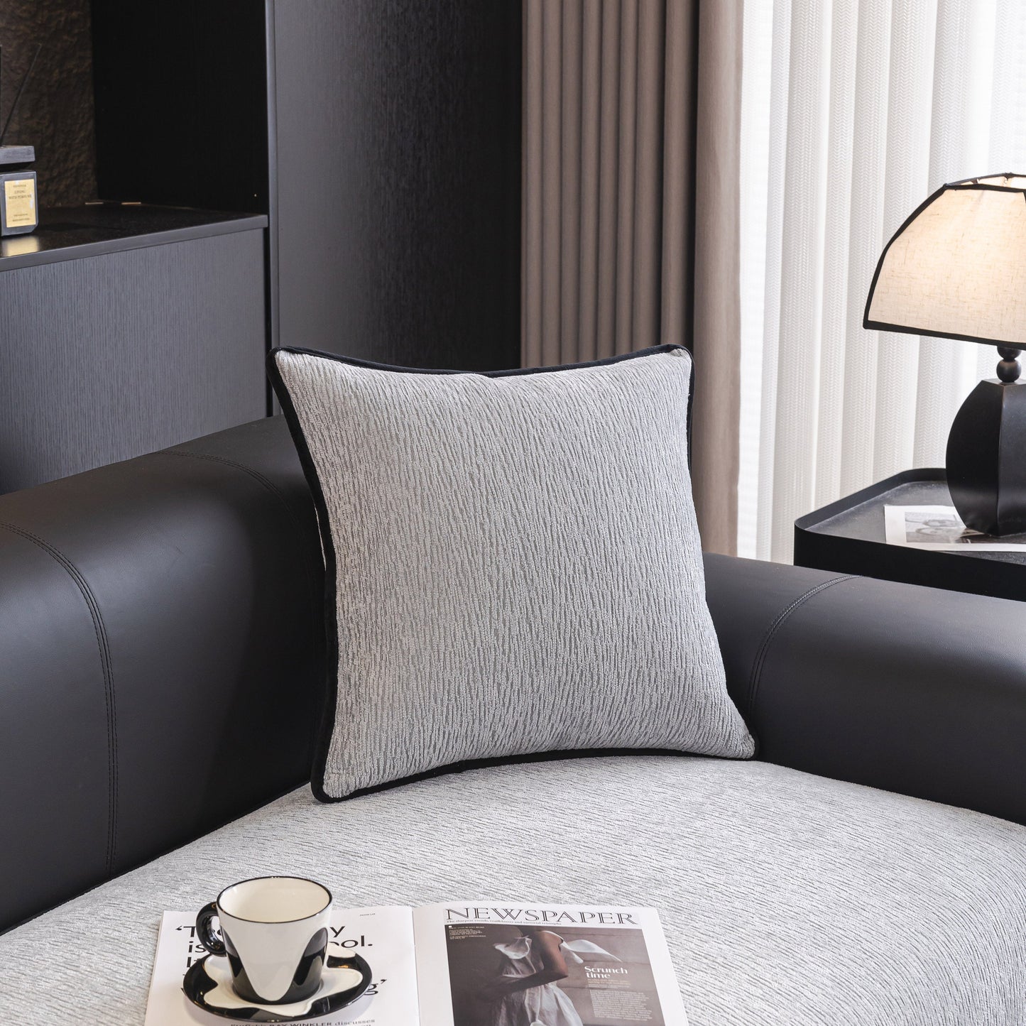 Elegant living room with modern pillow on leather couch, stylish table setup, for sophisticated home decor inspiration
