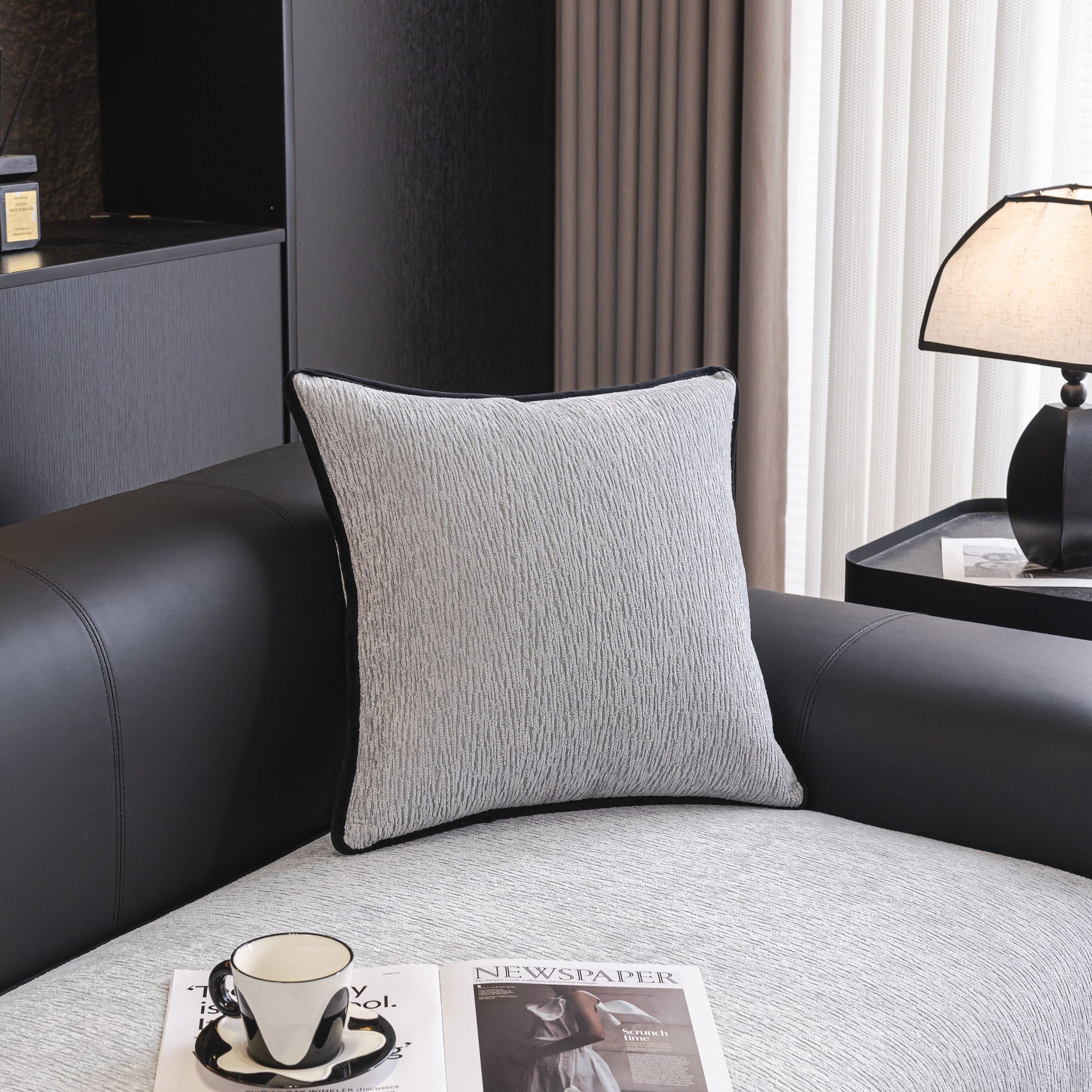 Elegant living room with modern pillow on leather couch, stylish table setup, for sophisticated home decor inspiration