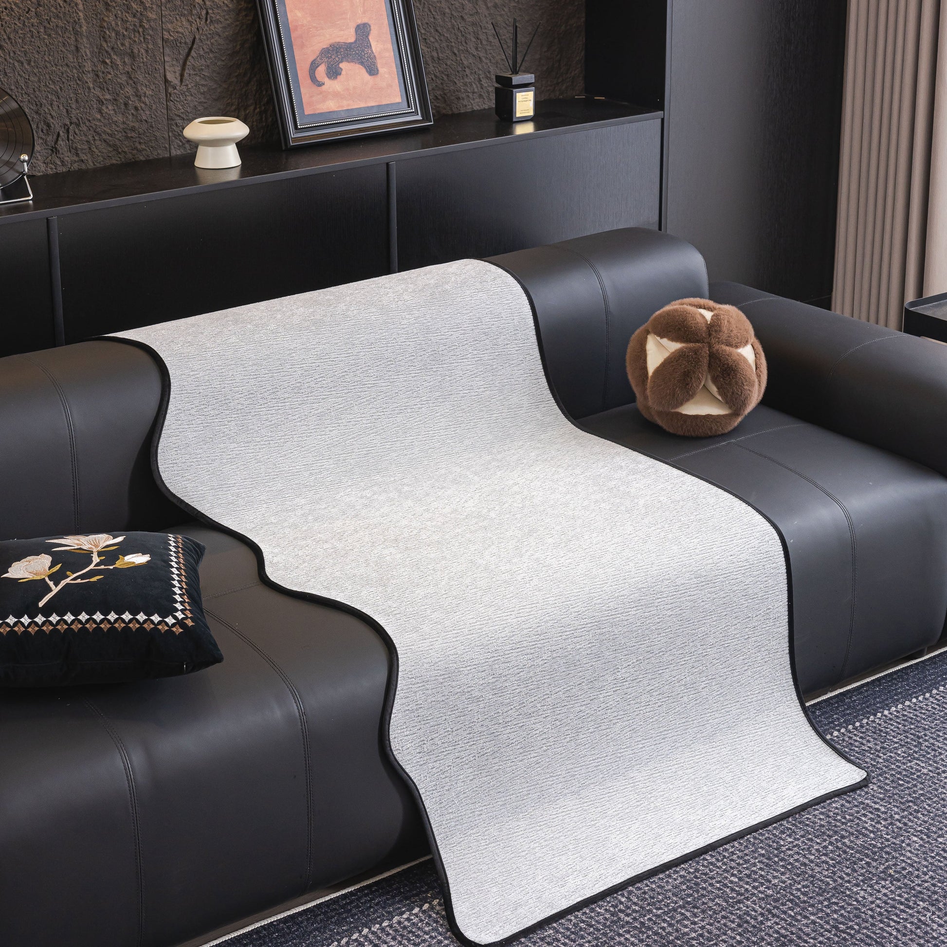 Chenille Couch Cover with Scalloped Edge, Non-Slip Modular Slipcover Sectional displayed on dark sofa in modern living room