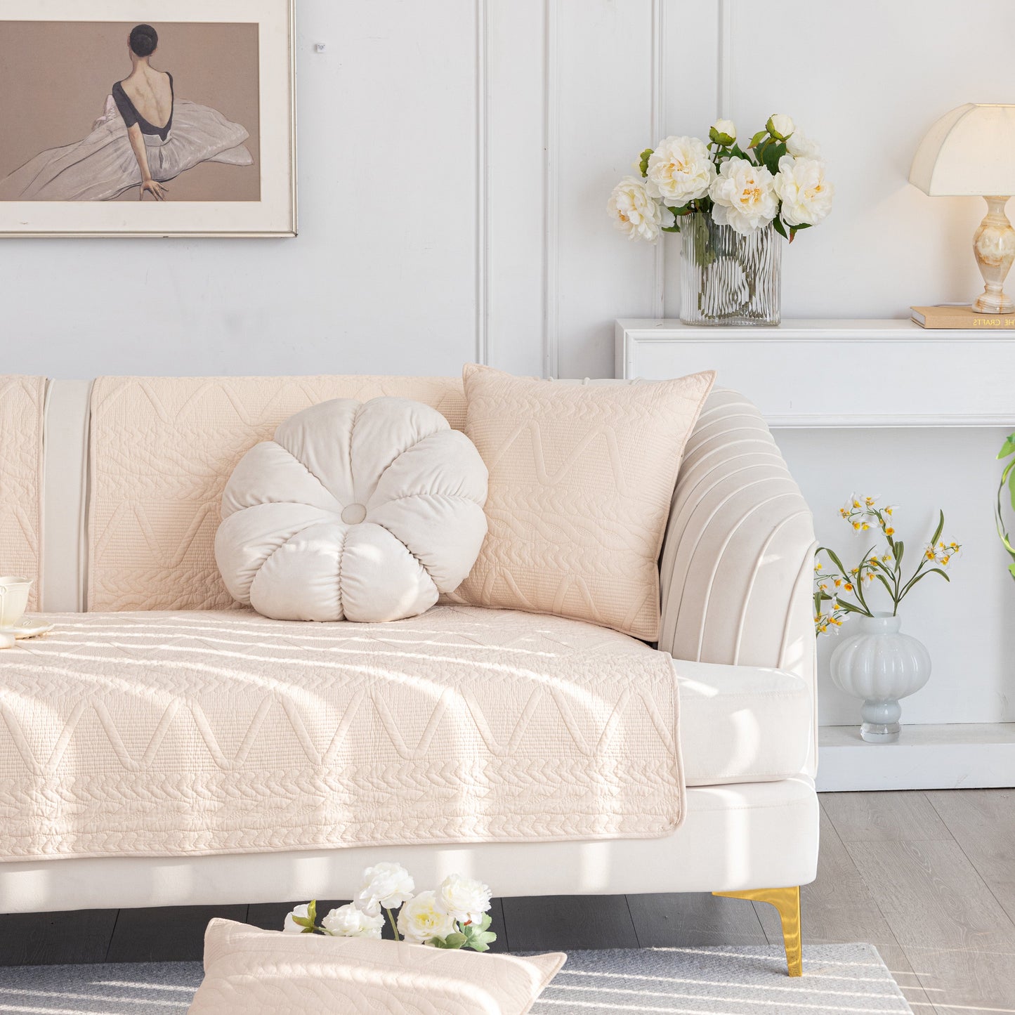Geometric Textured Cotton Quilted Sofa Cover, Non-Slip Washable Couch Protector on elegant white sofa in bright living room.