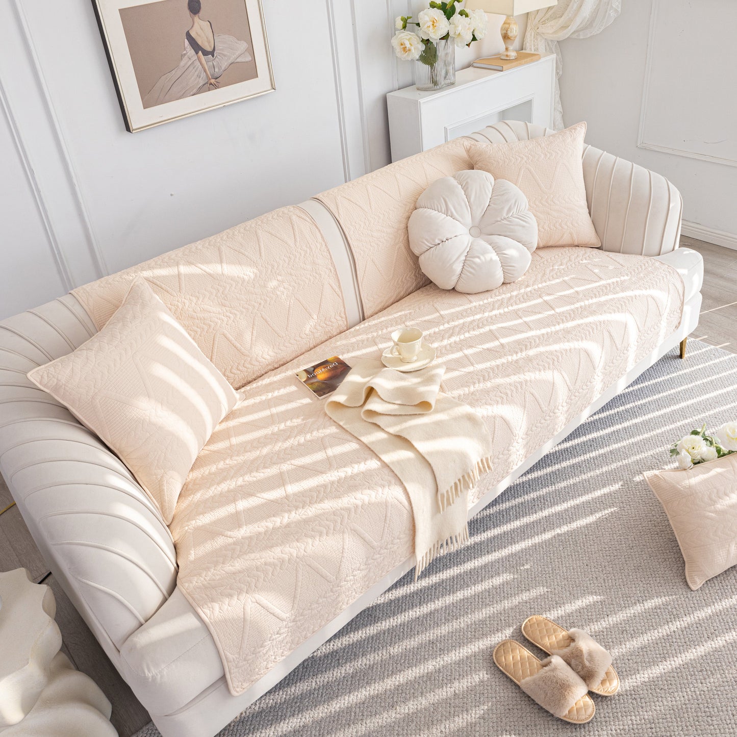 Geometric Textured Cotton Quilted Sofa Cover, Non-Slip Washable Couch Protector on elegant white sofa in modern living room.