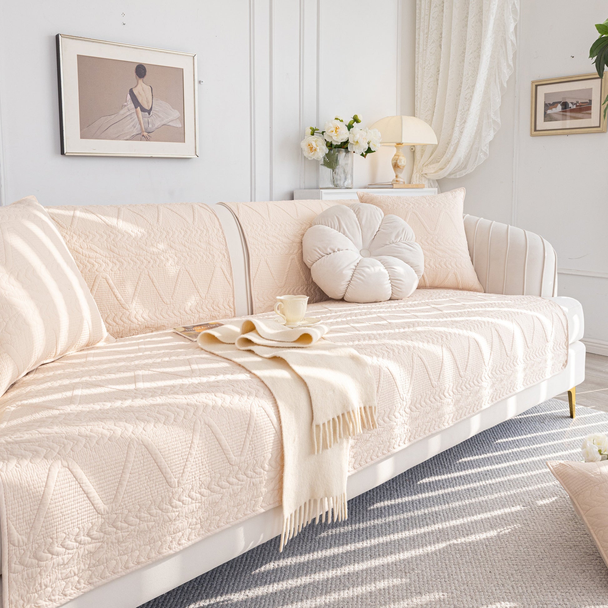 Geometric Textured Cotton Quilted Sofa Cover, Non-Slip Washable Couch Protector on a stylish modern sofa in a cozy living room