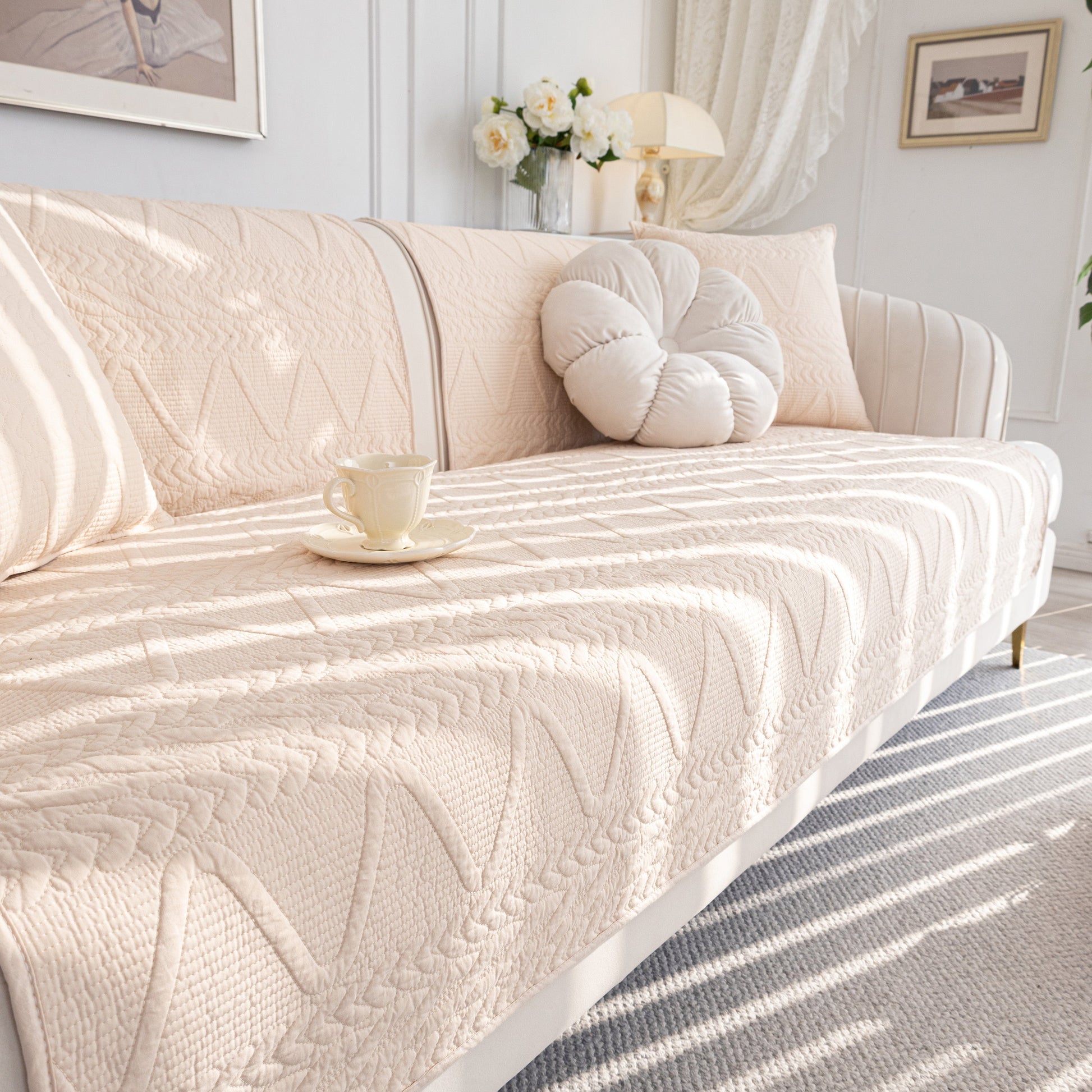 Geometric Textured Cotton Quilted Sofa Cover, Non-Slip Washable Couch Protector on modern sofa in elegant living room.