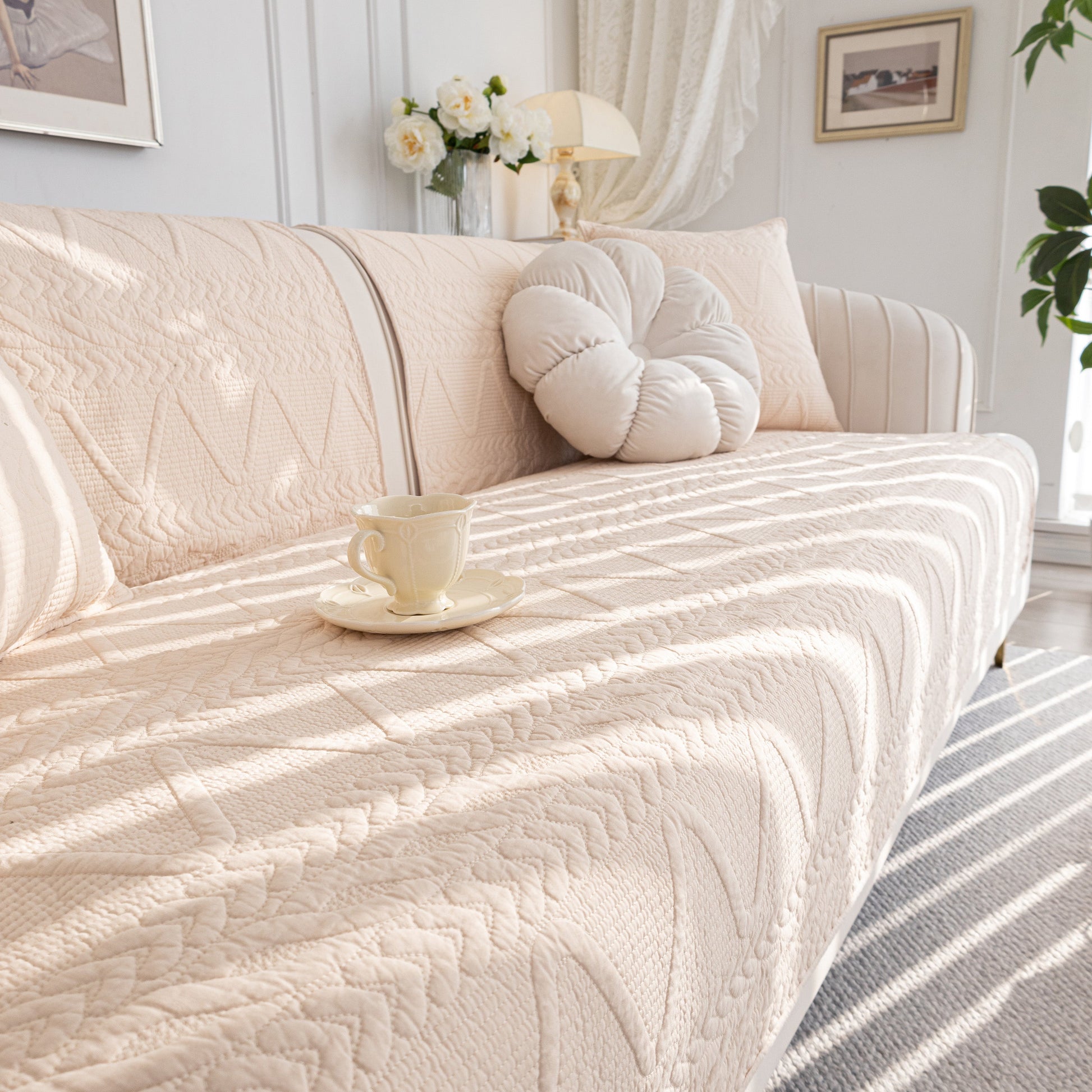 Geometric Textured Cotton Quilted Sofa Cover, Non-Slip Washable Couch Protector on modern living room sofa with elegant decor.