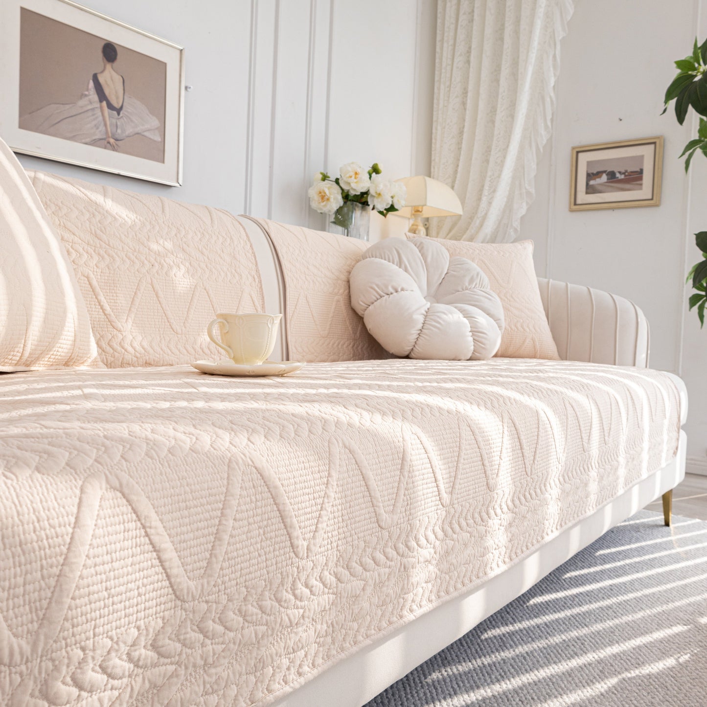 Geometric Textured Cotton Quilted Sofa Cover, Non-Slip Washable Couch Protector draped over a modern sofa in a chic living room setting.