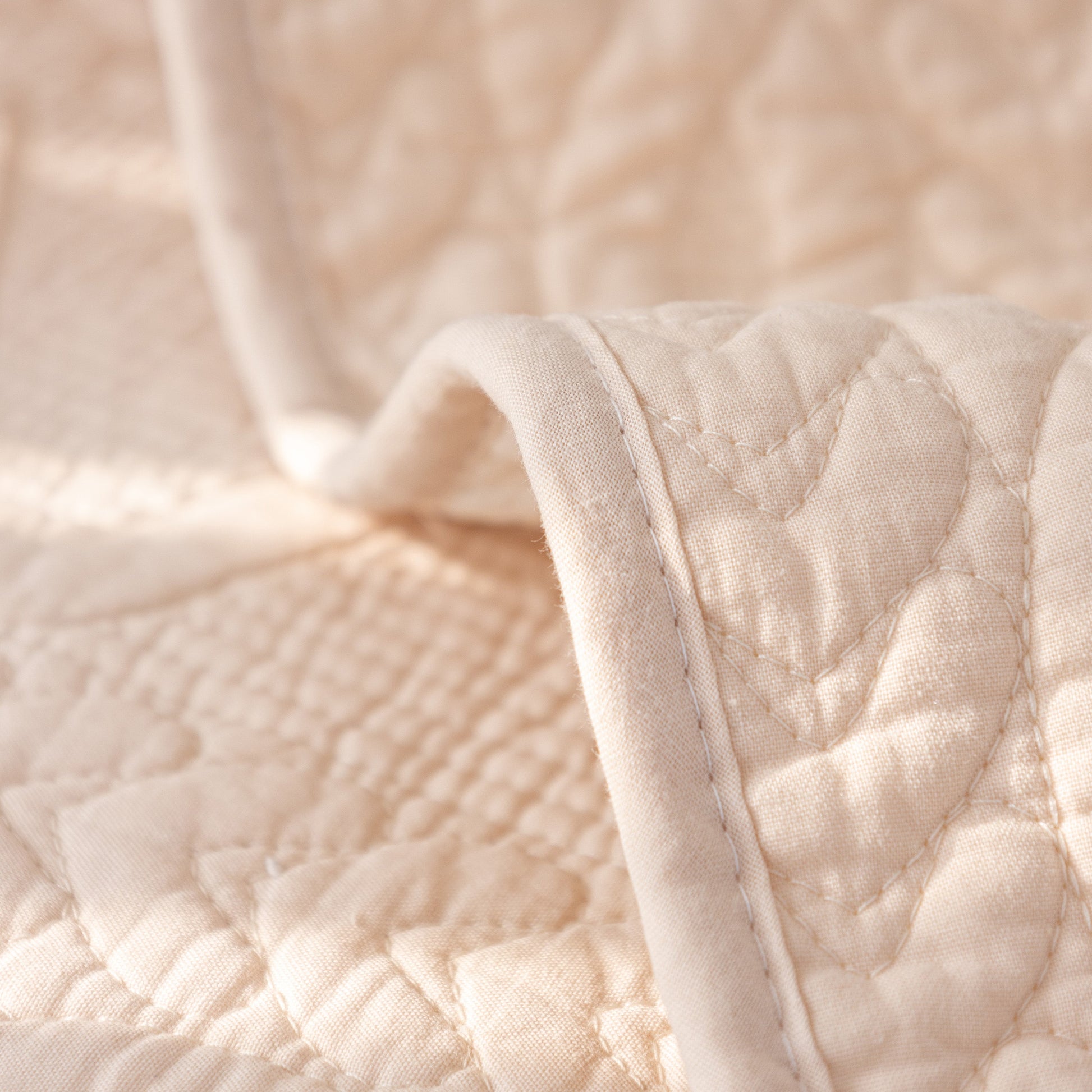 Geometric Textured Cotton Quilted Sofa Cover, Non-Slip Washable Couch Protector with intricate stitching and angular motifs