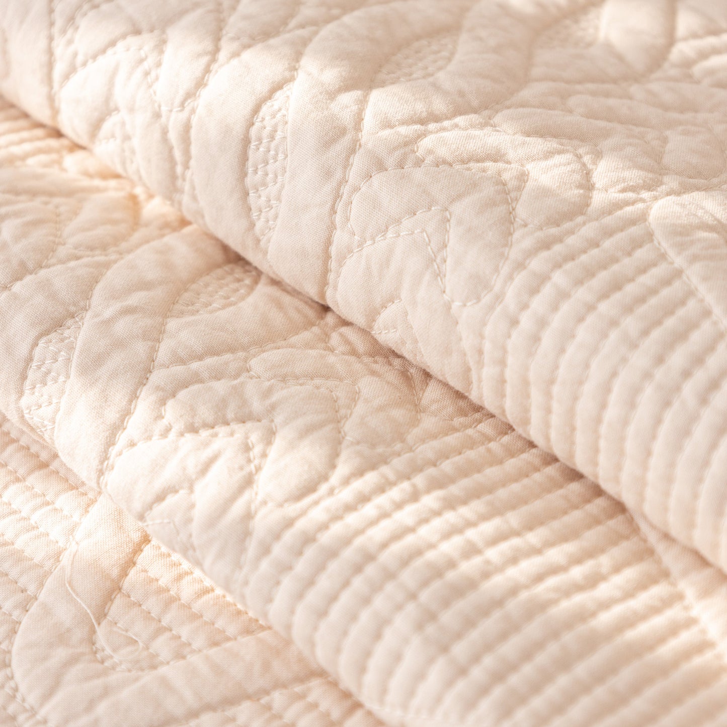 Geometric Textured Cotton Quilted Sofa Cover, Non-Slip Washable Couch Protector with intricate stitched patterns and natural cotton fabric.