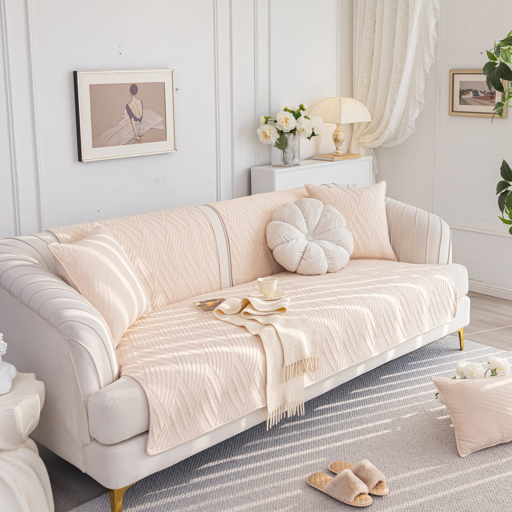 Cozy living room with a quilted geometric cotton sofa cover, non-slip & thick padded furniture covers, in a soft cream color.