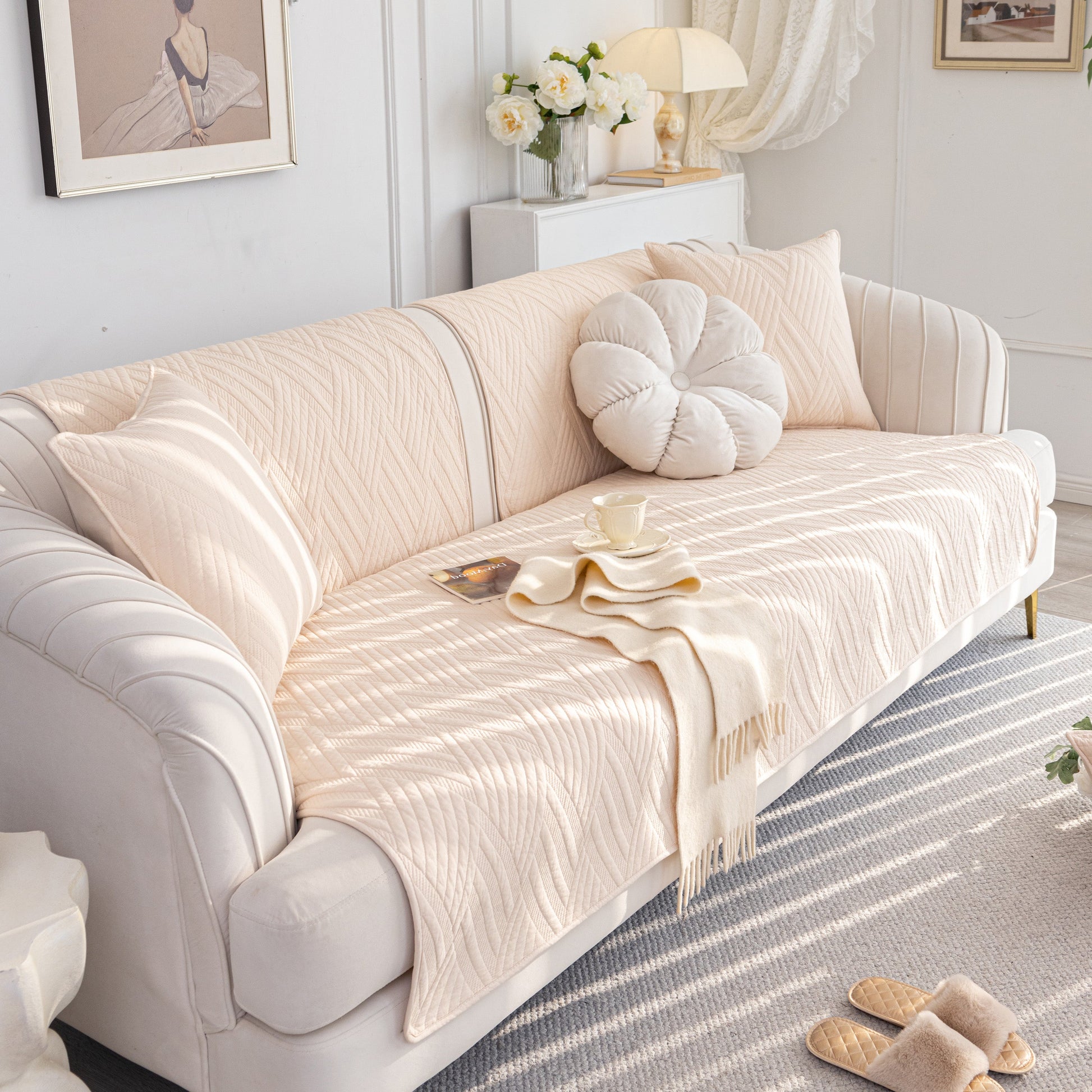 Quilted Geometric Cotton Sofa Cover, Non-Slip & Thick Padded Furniture Covers on a white couch in a cozy living room.