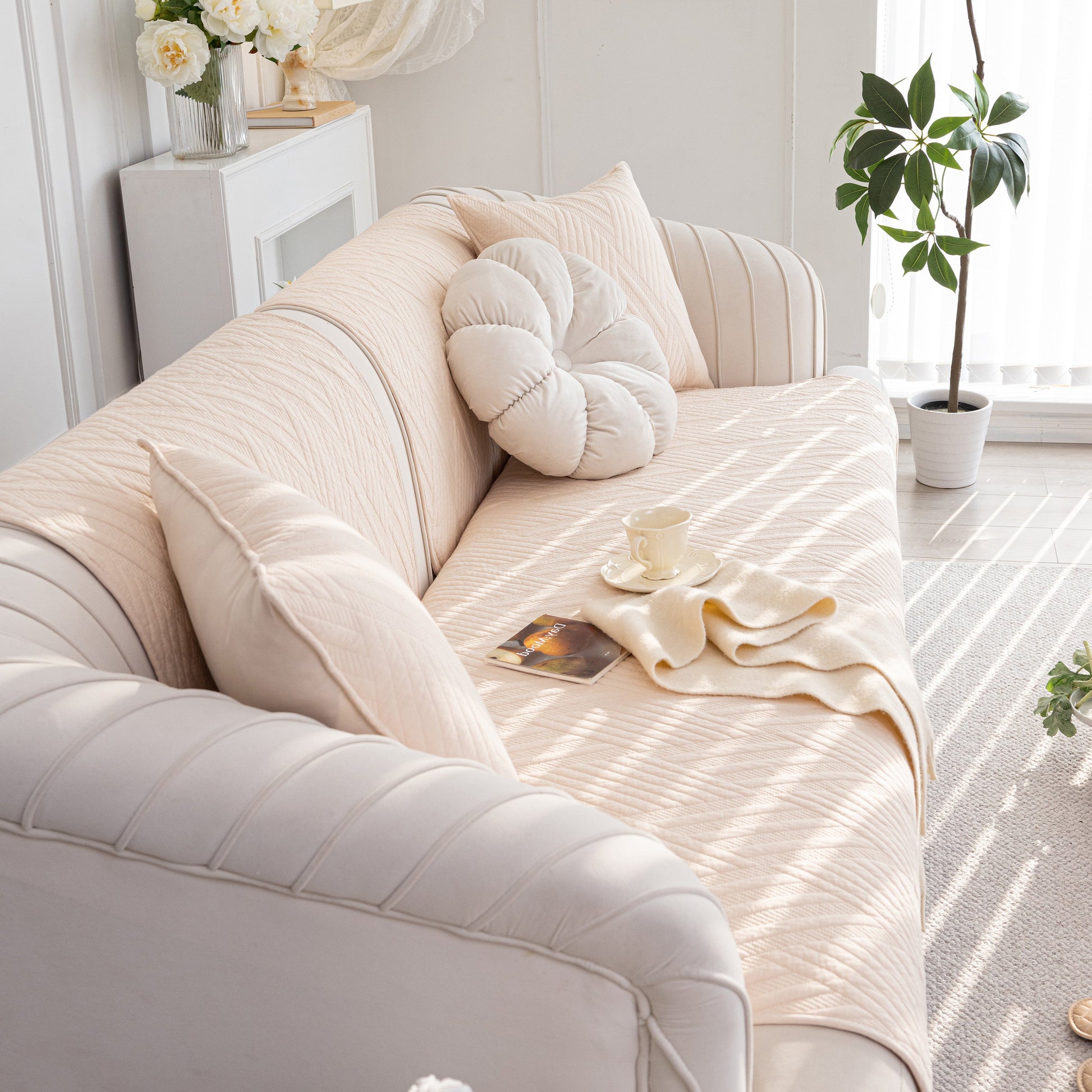 Quilted Geometric Cotton Sofa Cover on a beige sofa, showcasing a non-slip design and thick padded furniture protection.