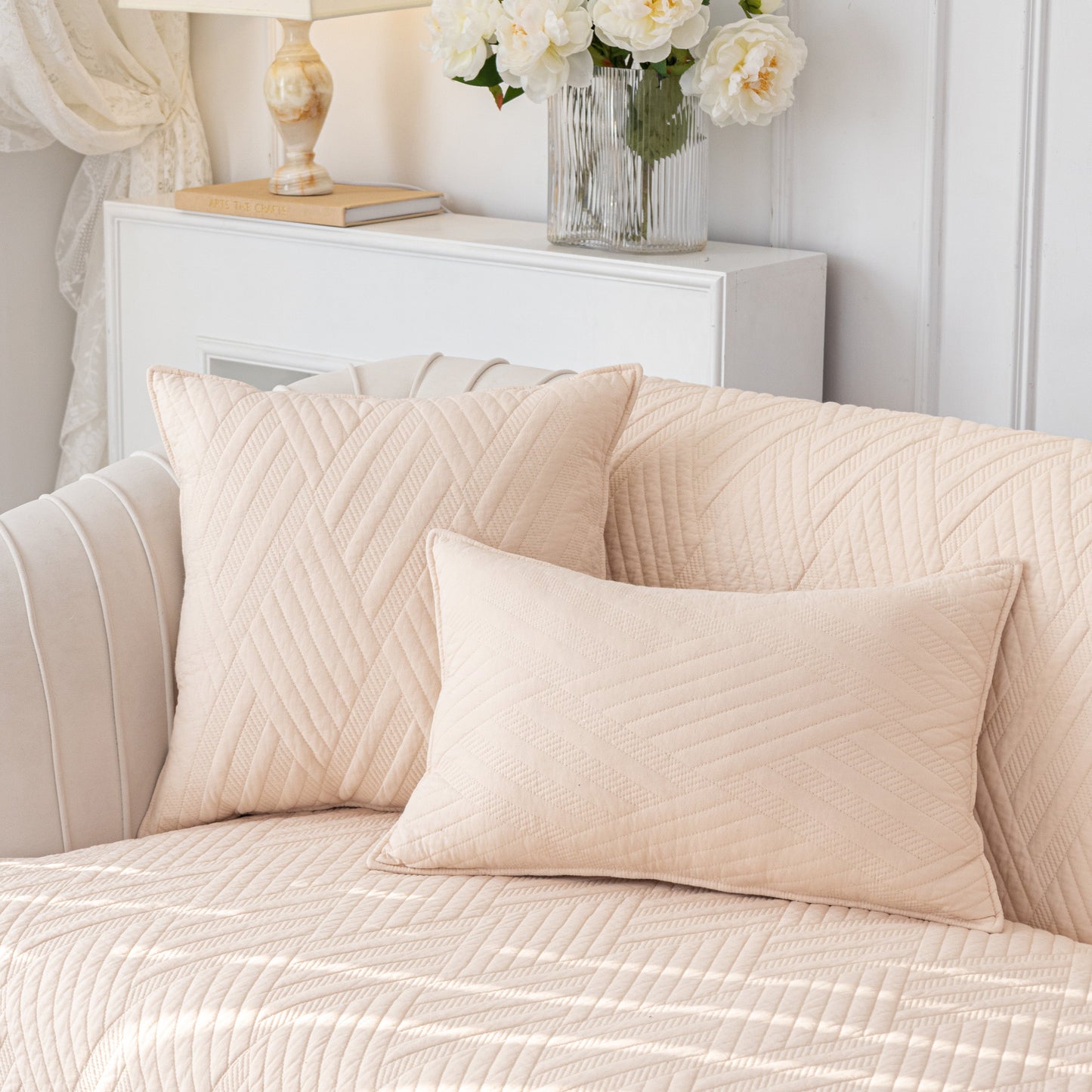 Quilted Geometric Cotton Sofa Cover, Non-Slip & Thick Padded Furniture Covers displayed on a sofa with matching cushions.