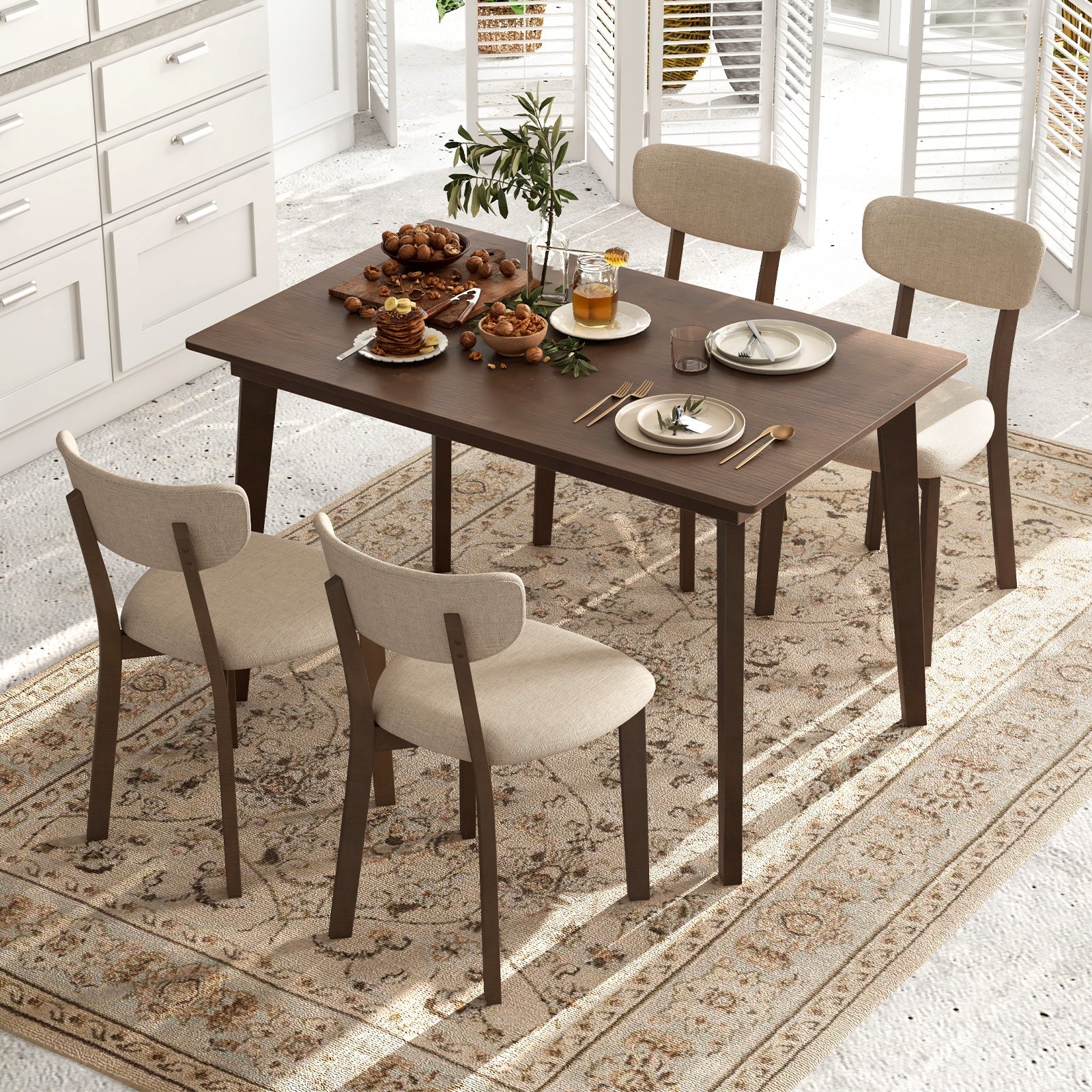5-Piece Dining Table Set for 4 with Rubber Wood Frame and Padded Set-Brown in a dining room setting.