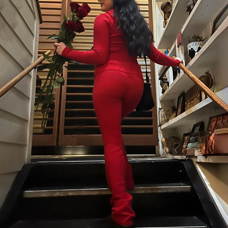Woman in Long Sleeve Sweater And High Waist Long Pants Set holding roses on stairs