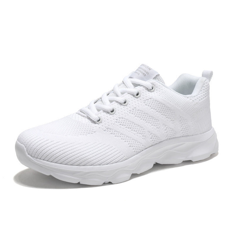 Women’s Mesh Running & Travel Sneakers in white with breathable mesh uppers and cushioned soles for comfort and performance.